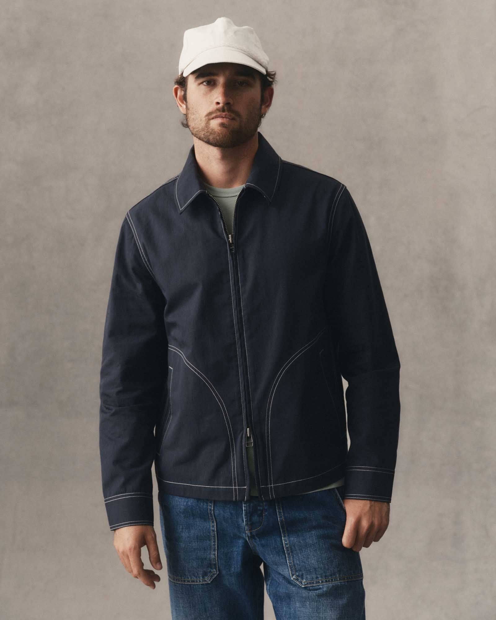 fit model posing in The Shore Jacket in Navy Twill, Wovens by Taylor Stitch