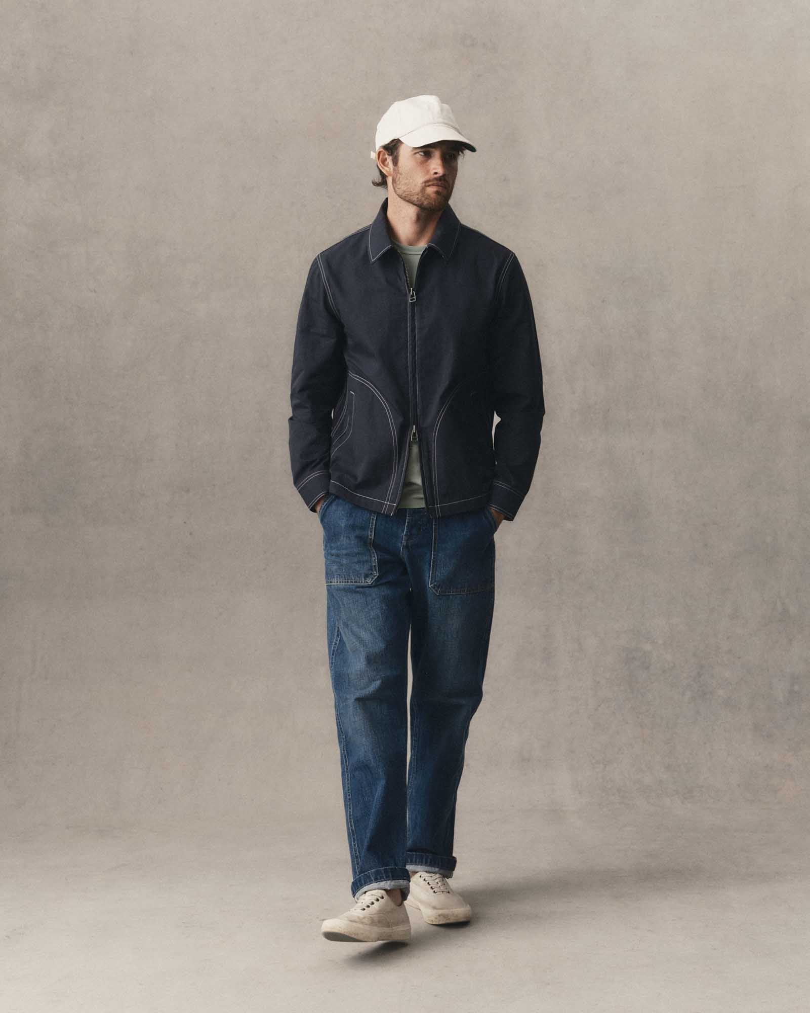 fit model walking wearing The Shore Jacket in Navy Twill, Wovens by Taylor Stitch
