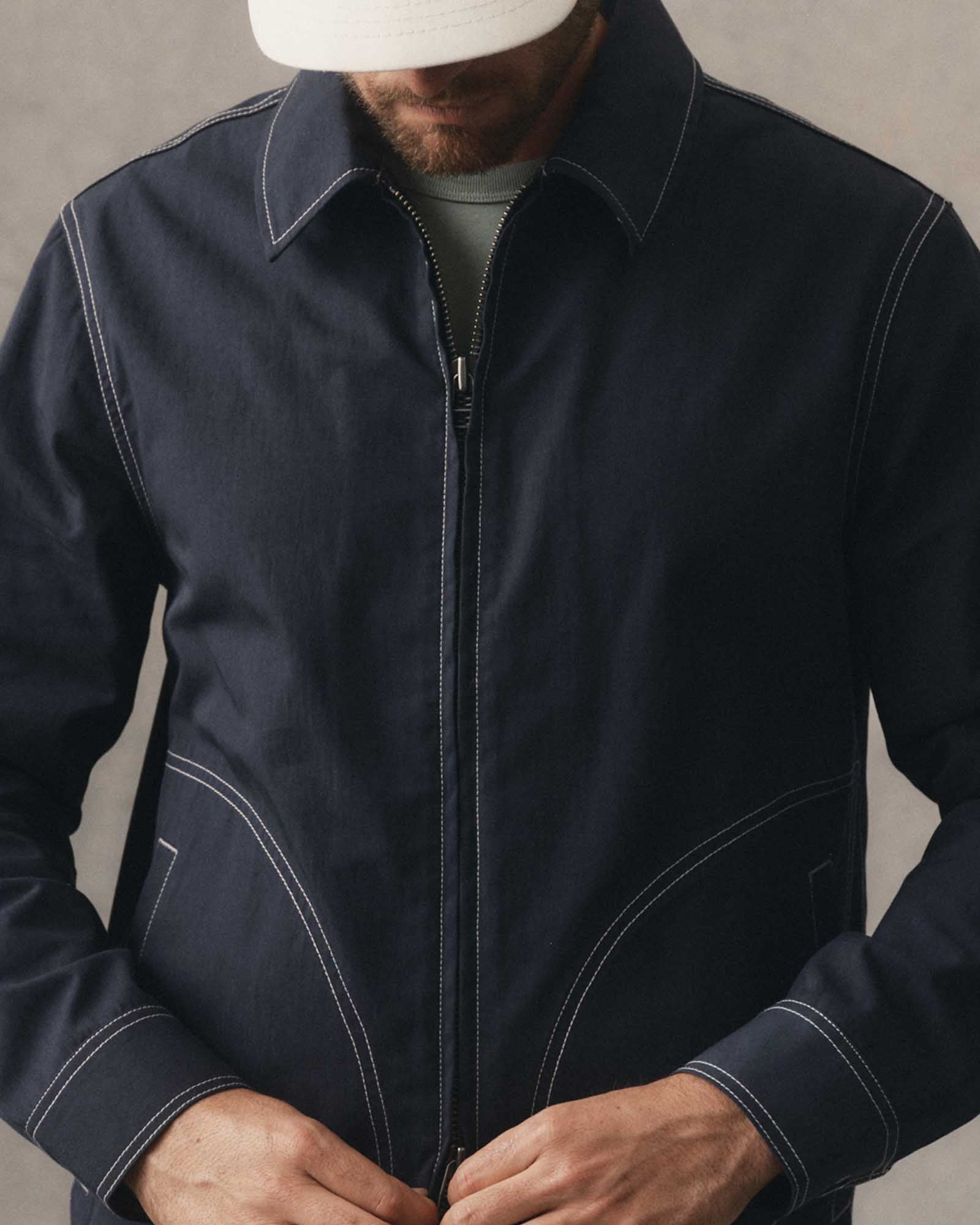 fit model posing in The Shore Jacket in Navy Twill, Wovens by Taylor Stitch