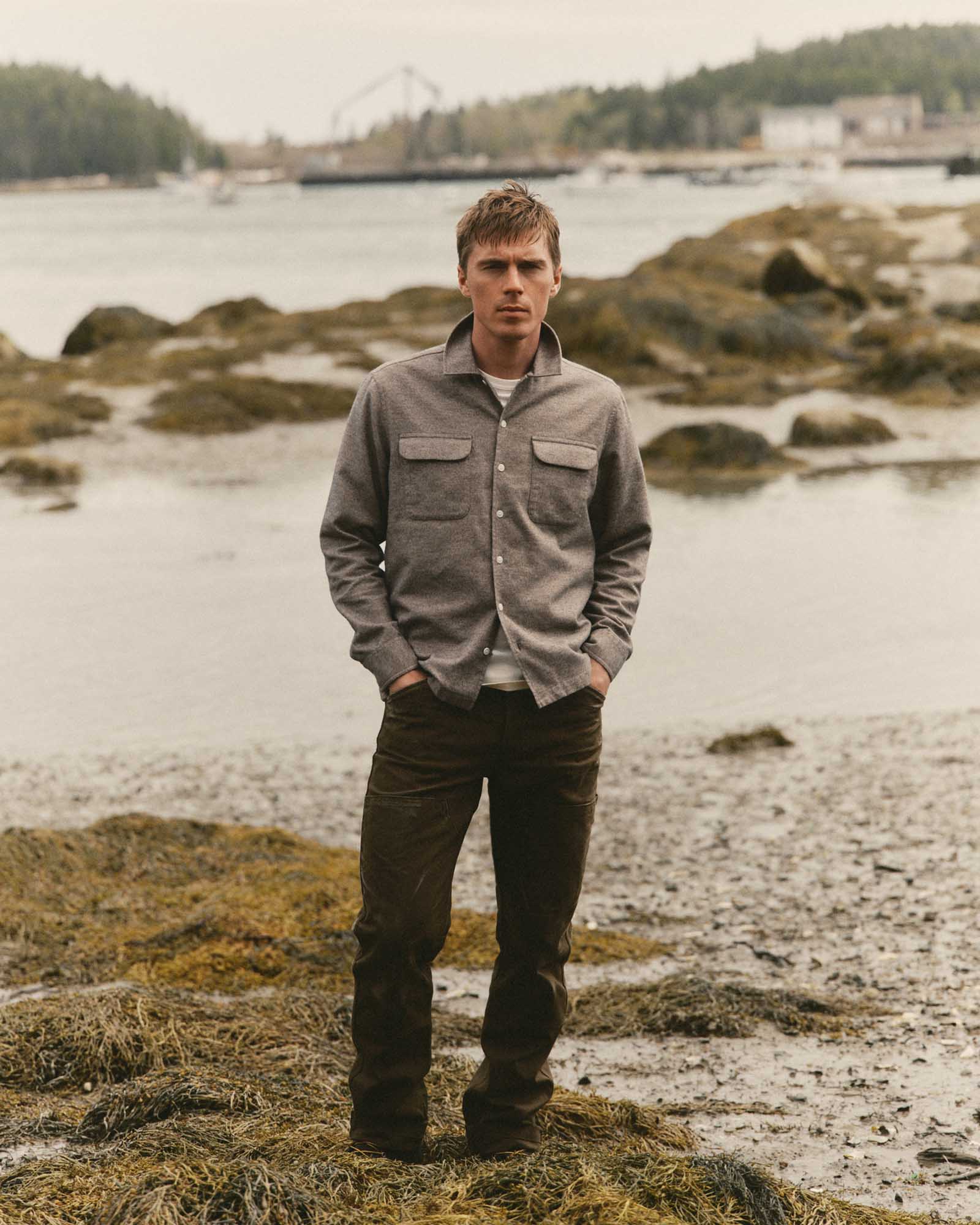 fit model posing in The Shore Shirt in Driftwood Portuguese Mouline Flannel, Wovens by Taylor Stitch