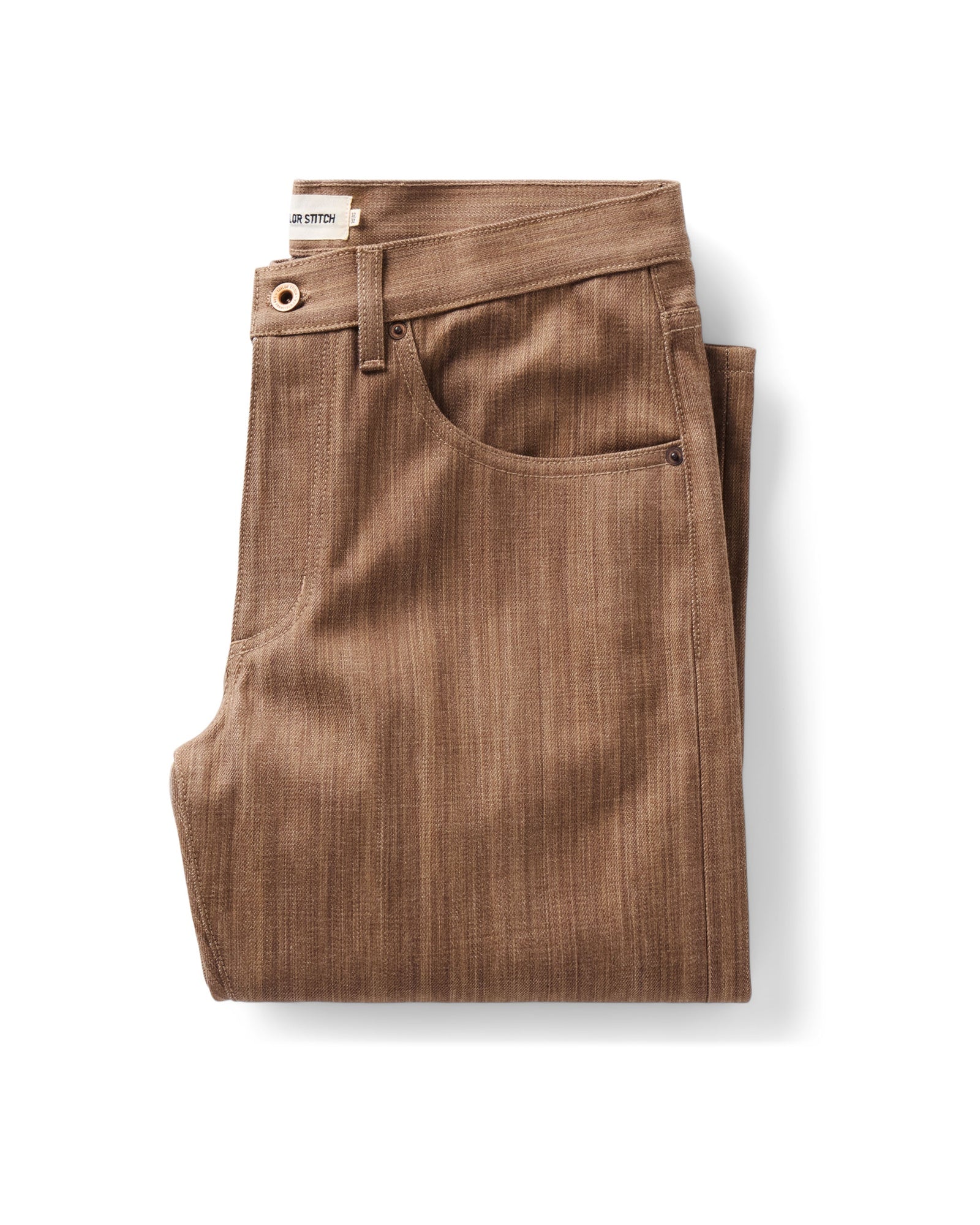 folded flatlay of The Straight Jean in Kakishibu Selvedge, Bottoms by Taylor Stitch
