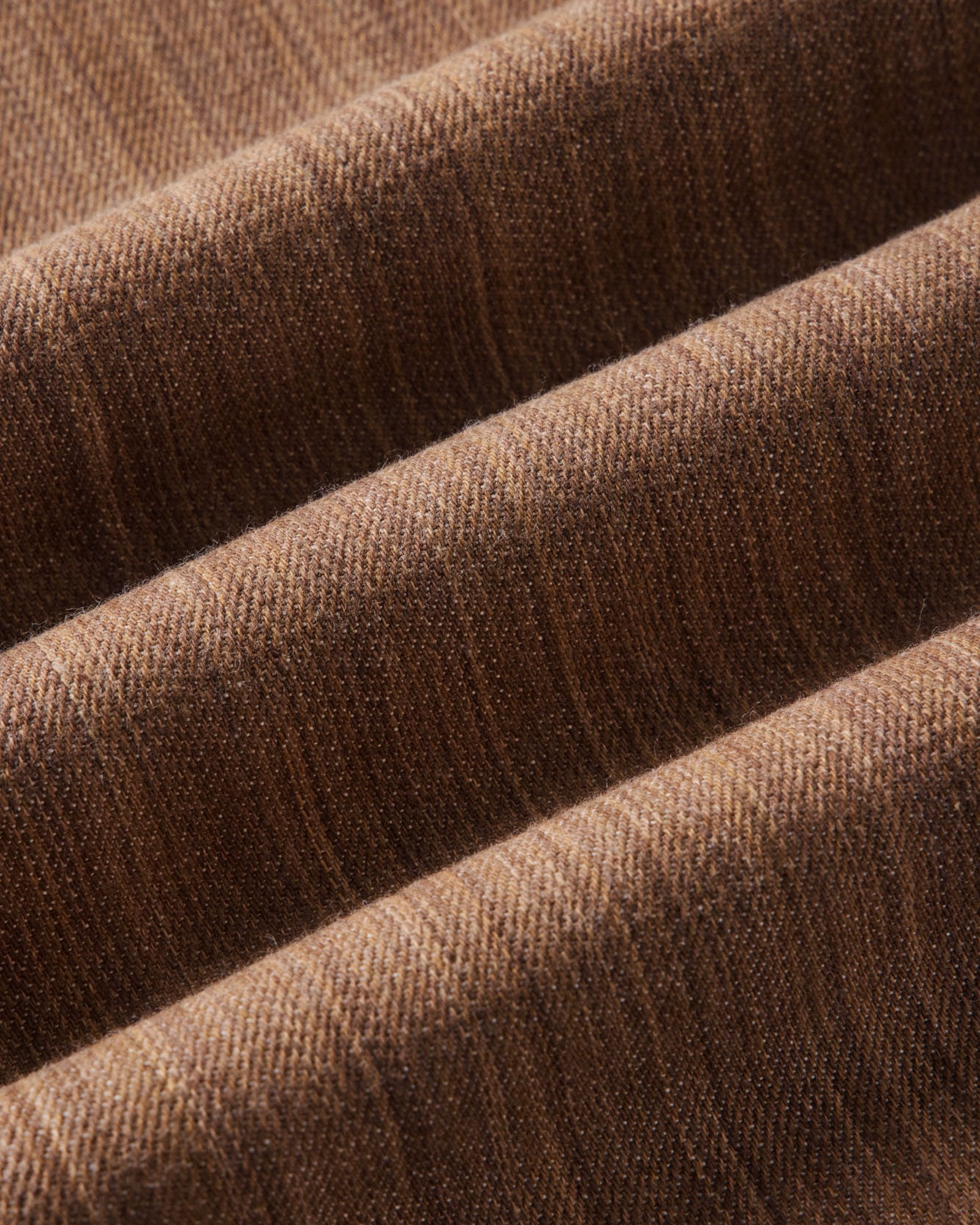 material shot of the fabric on The Straight Jean in Kakishibu Selvedge, Bottoms by Taylor Stitch