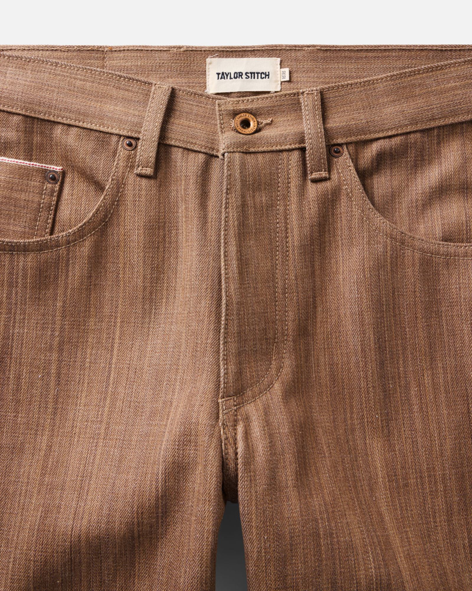 material shot of the waistband on The Straight Jean in Kakishibu Selvedge, Bottoms by Taylor Stitch