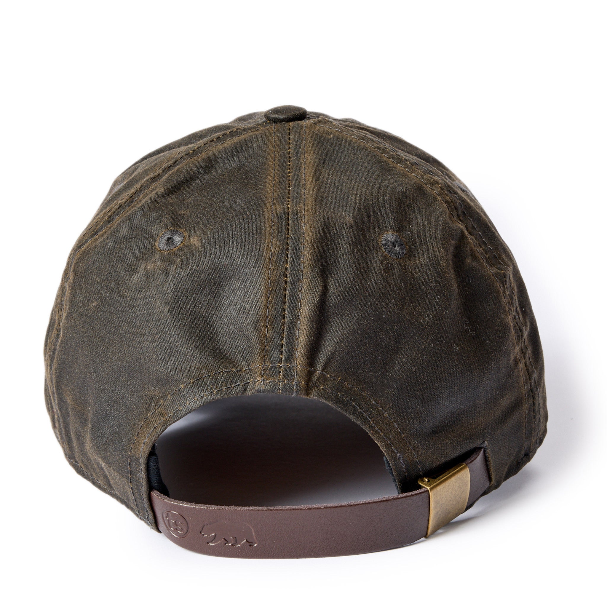 material shot of the leather slide adjustment on The Ball Cap in Soil Waxed Canvas, Accessories by Taylor Stitch