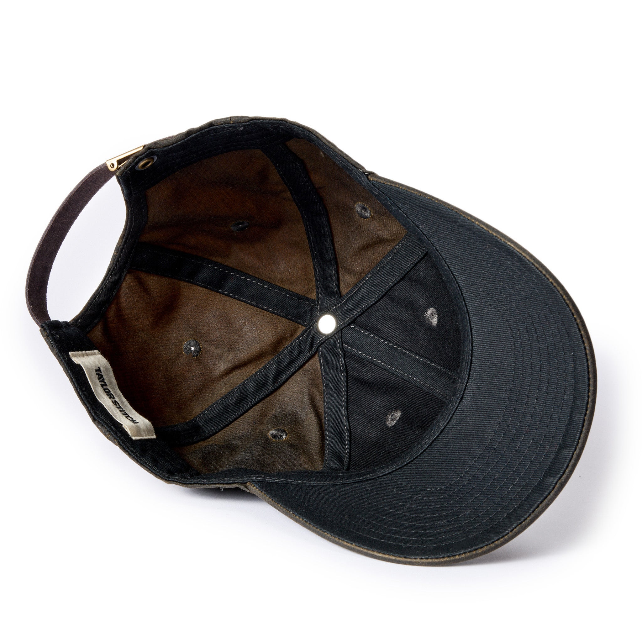 material shot of the interior on The Ball Cap in Soil Waxed Canvas, Accessories by Taylor Stitch