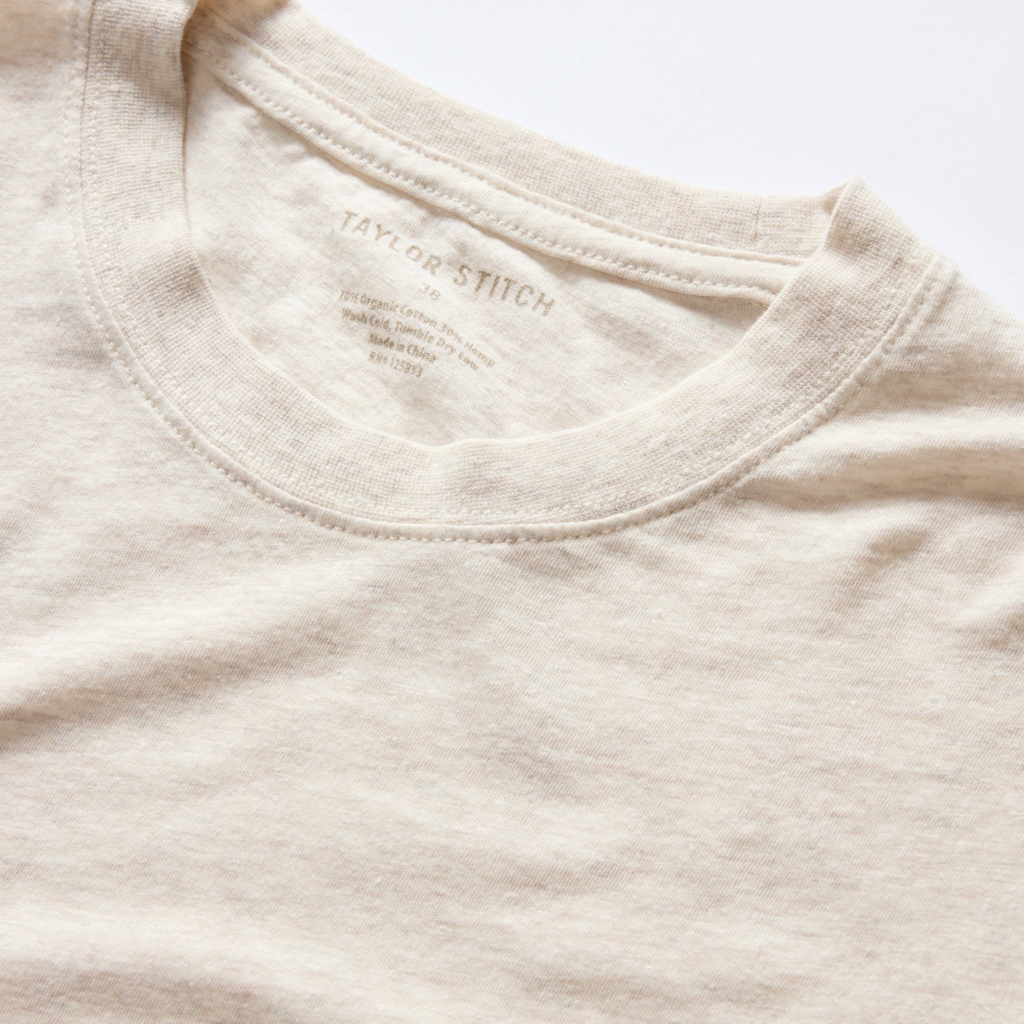 material shot of the collar on The Cotton Hemp Tee in Heather Oat, Knits by Taylor Stitch