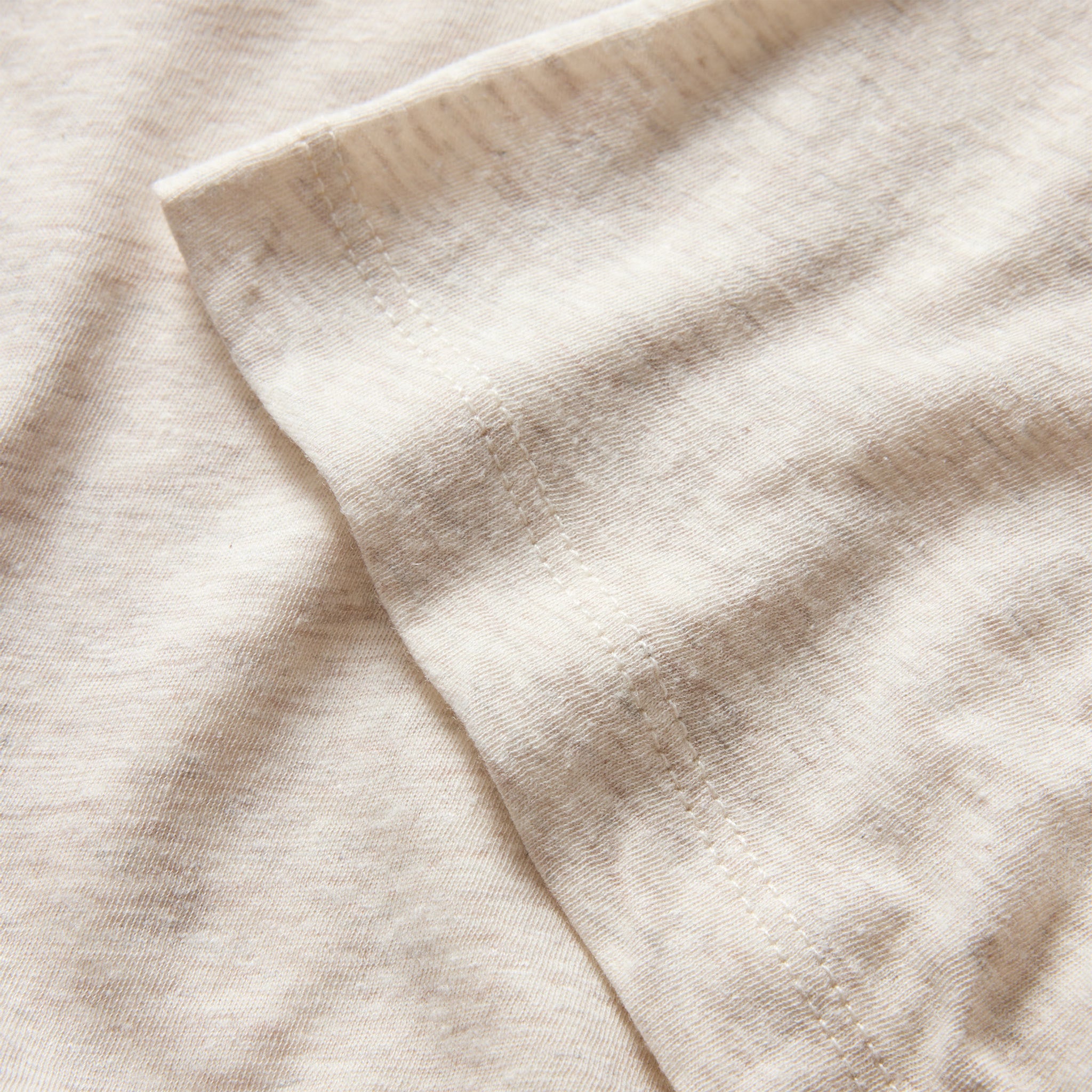 material shot of the sleeves on The Cotton Hemp Tee in Heather Oat, Knits by Taylor Stitch