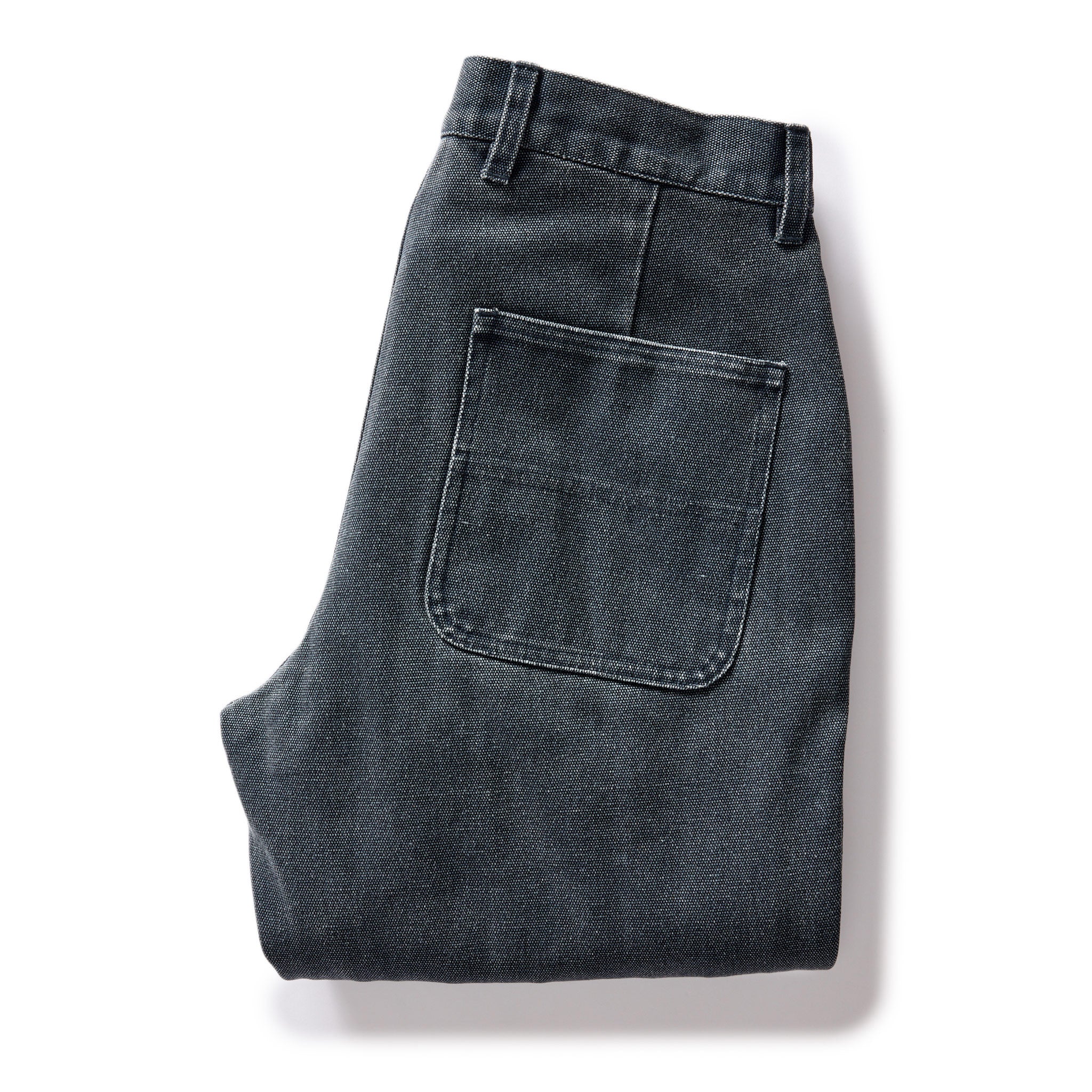flatlay of The Lined Chore Pant in Navy Chipped Canvas, folded from the back, Bottoms by Taylor Stitch