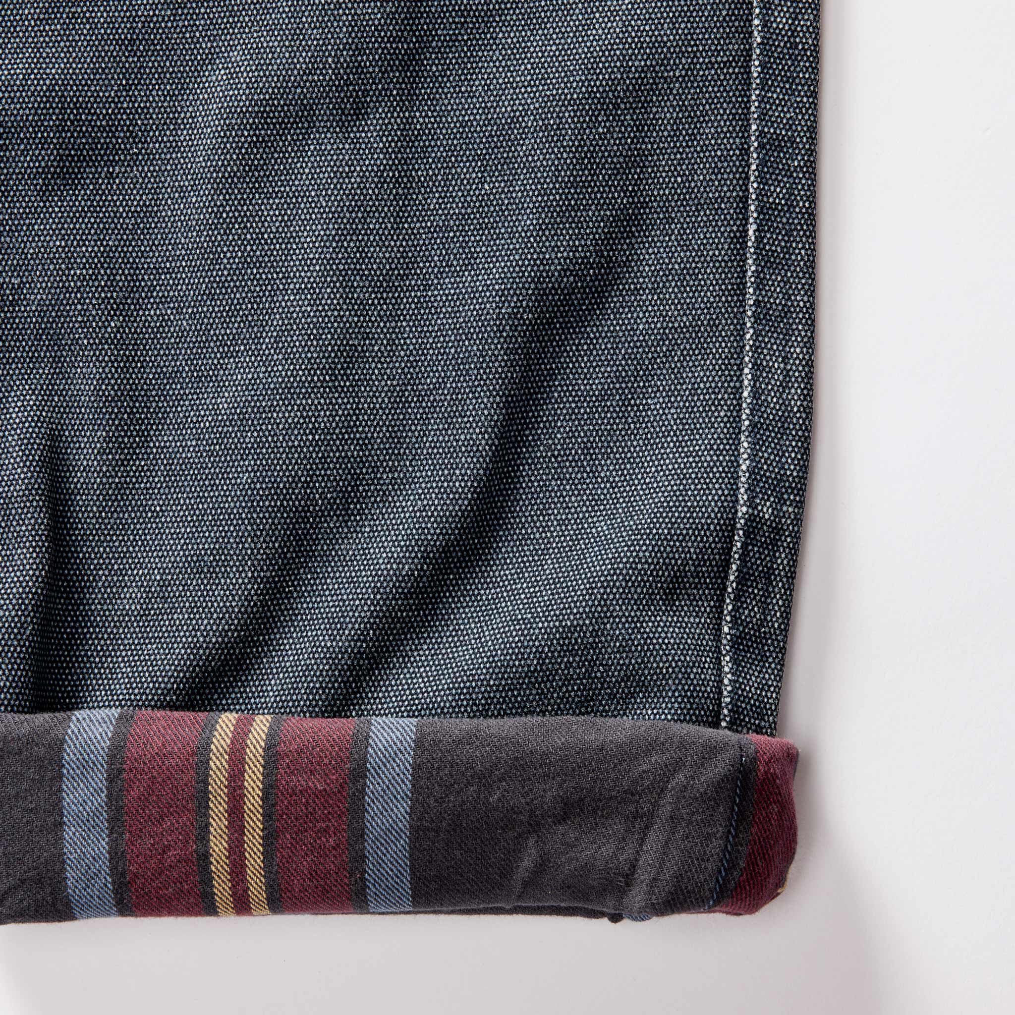 material shot of the flannel lining in The Lined Chore Pant in Navy Chipped Canvas, Bottoms by Taylor Stitch