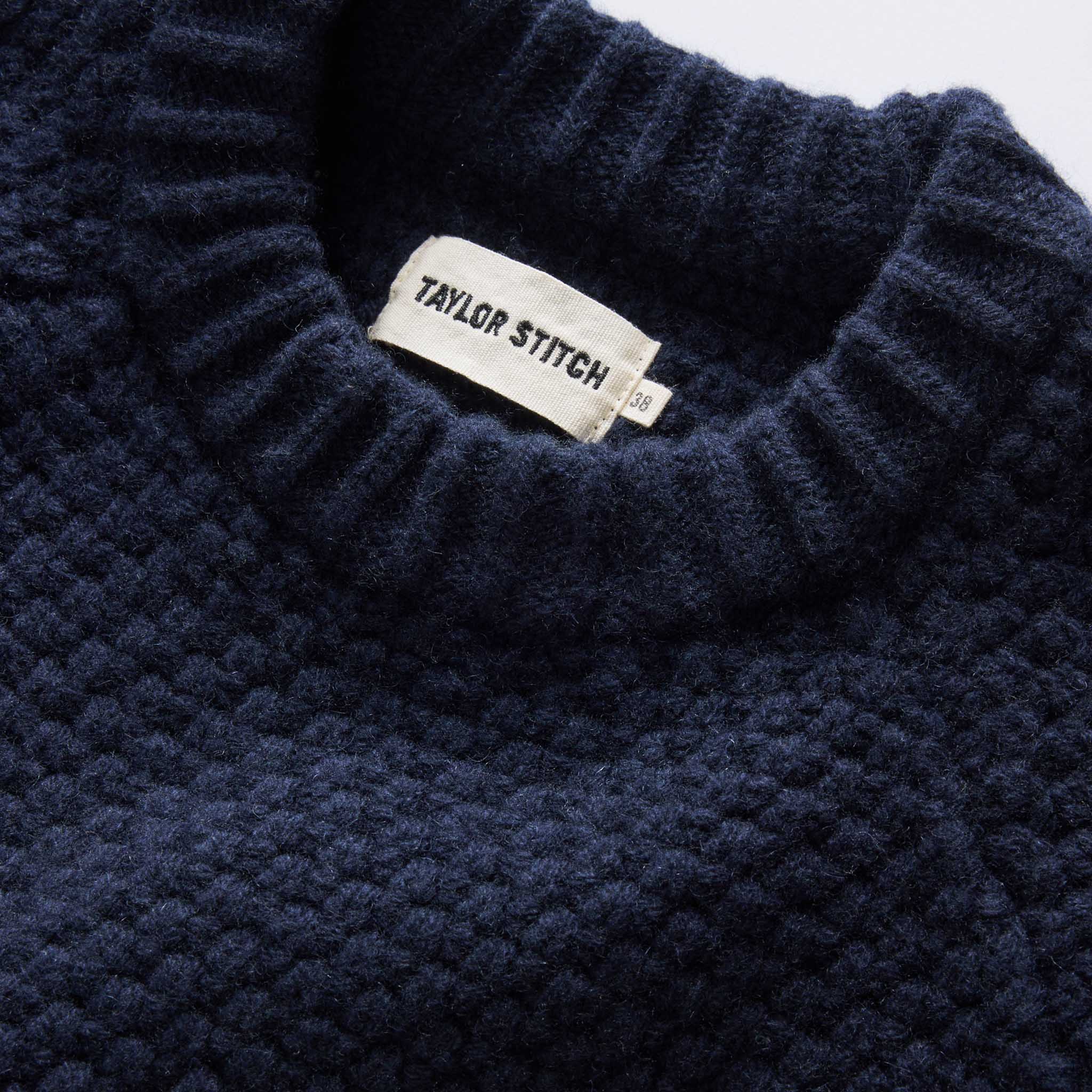 material shot of the collar on The Fisherman Sweater in Dark Navy Merino, Knits by Taylor Stitch
