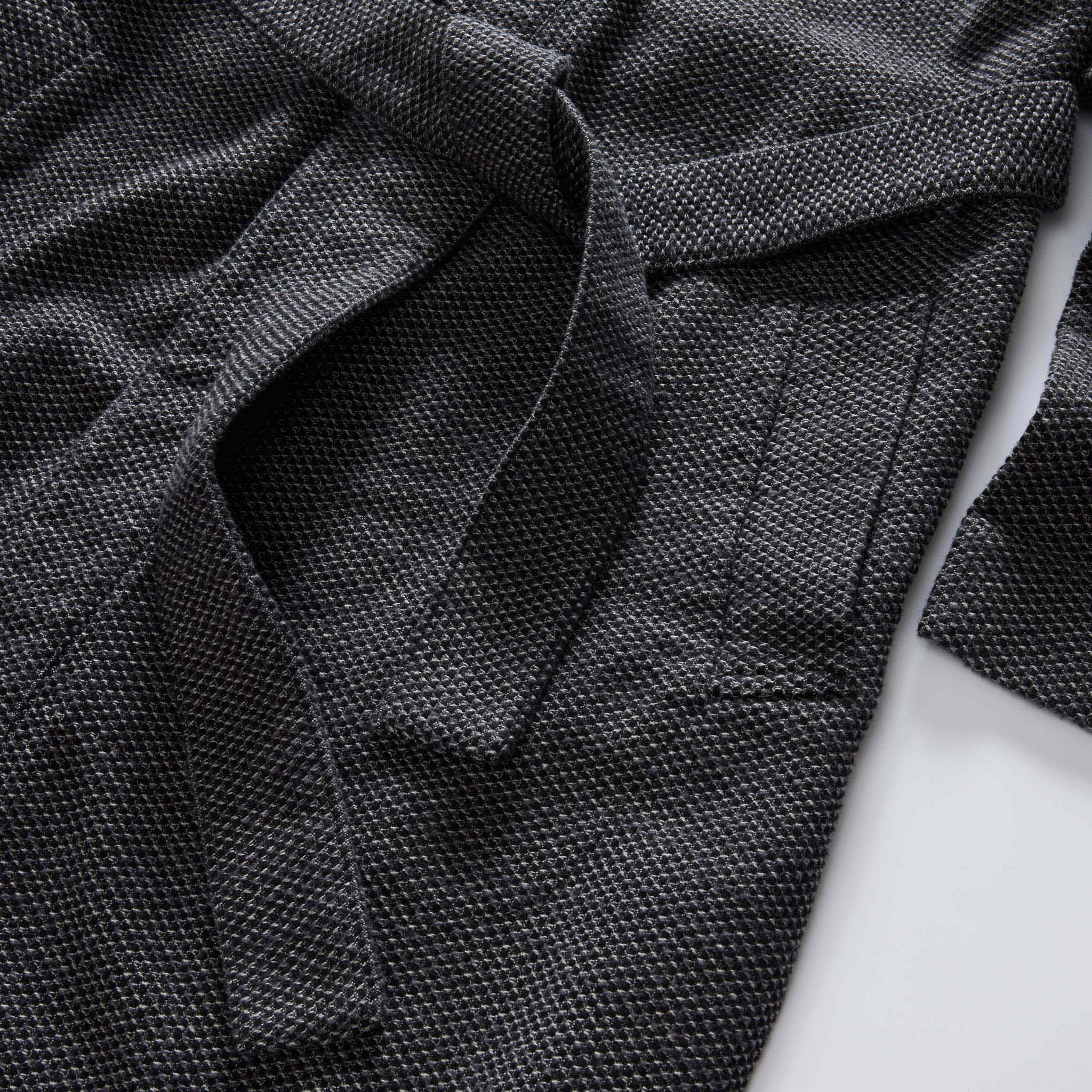 editorial flatlay of the pocket on The Apres Robe in Charcoal Sashiko, Accessories by Taylor Stitch
