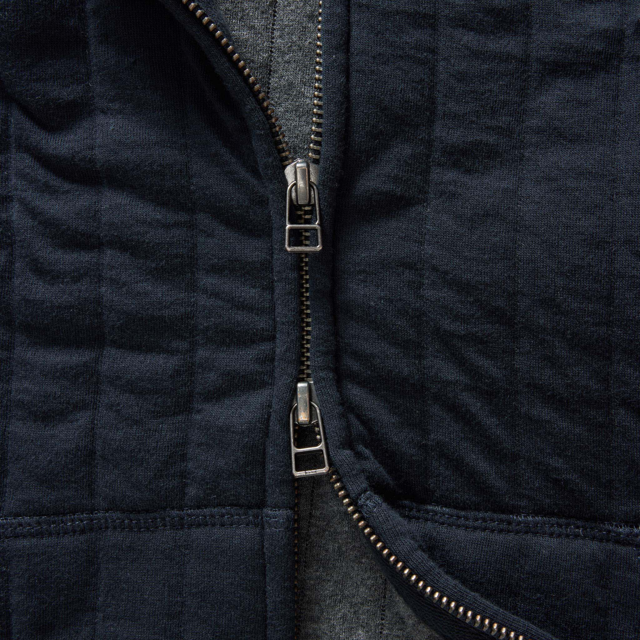 material shot of the zipper on The Apres Zip Hoodie in Heather Midnight Quilt, Knits by Taylor Stitch