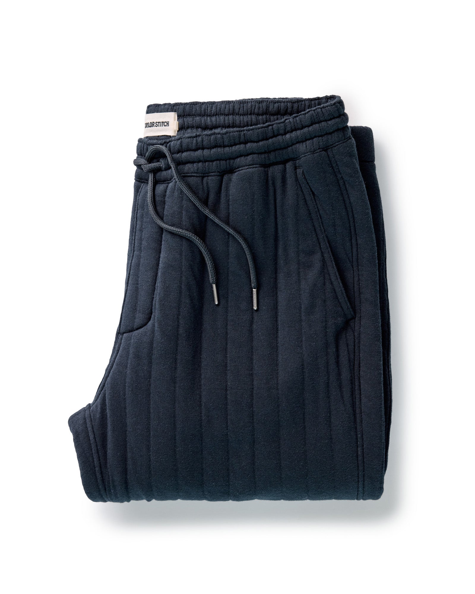 folded flatlay of The Quilted Apres Pant in Heather Midnight Jersey, Bottoms by Taylor Stitch