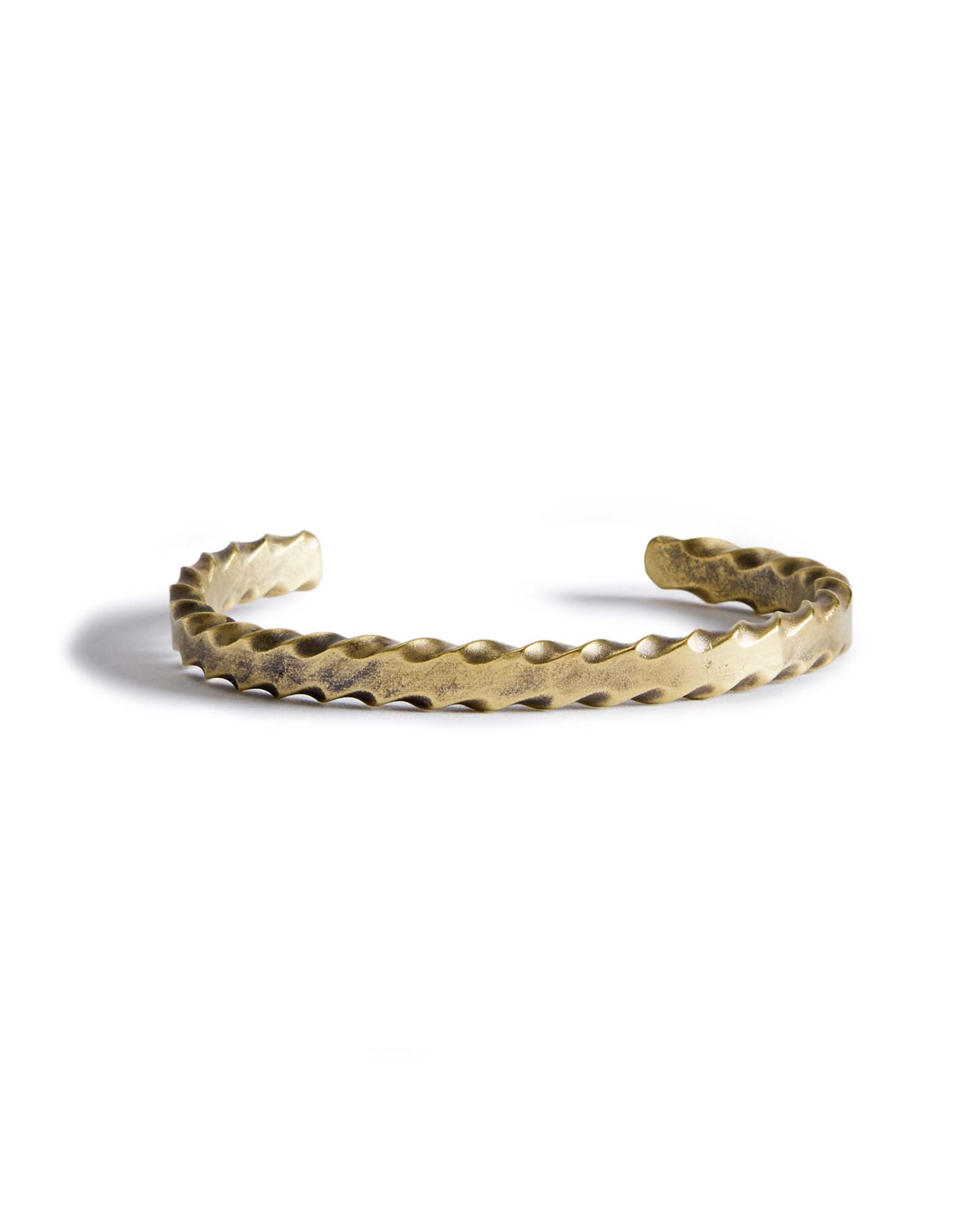 material shot of the front of The Twisted Cuff in Brass, Accessories by Taylor Stitch