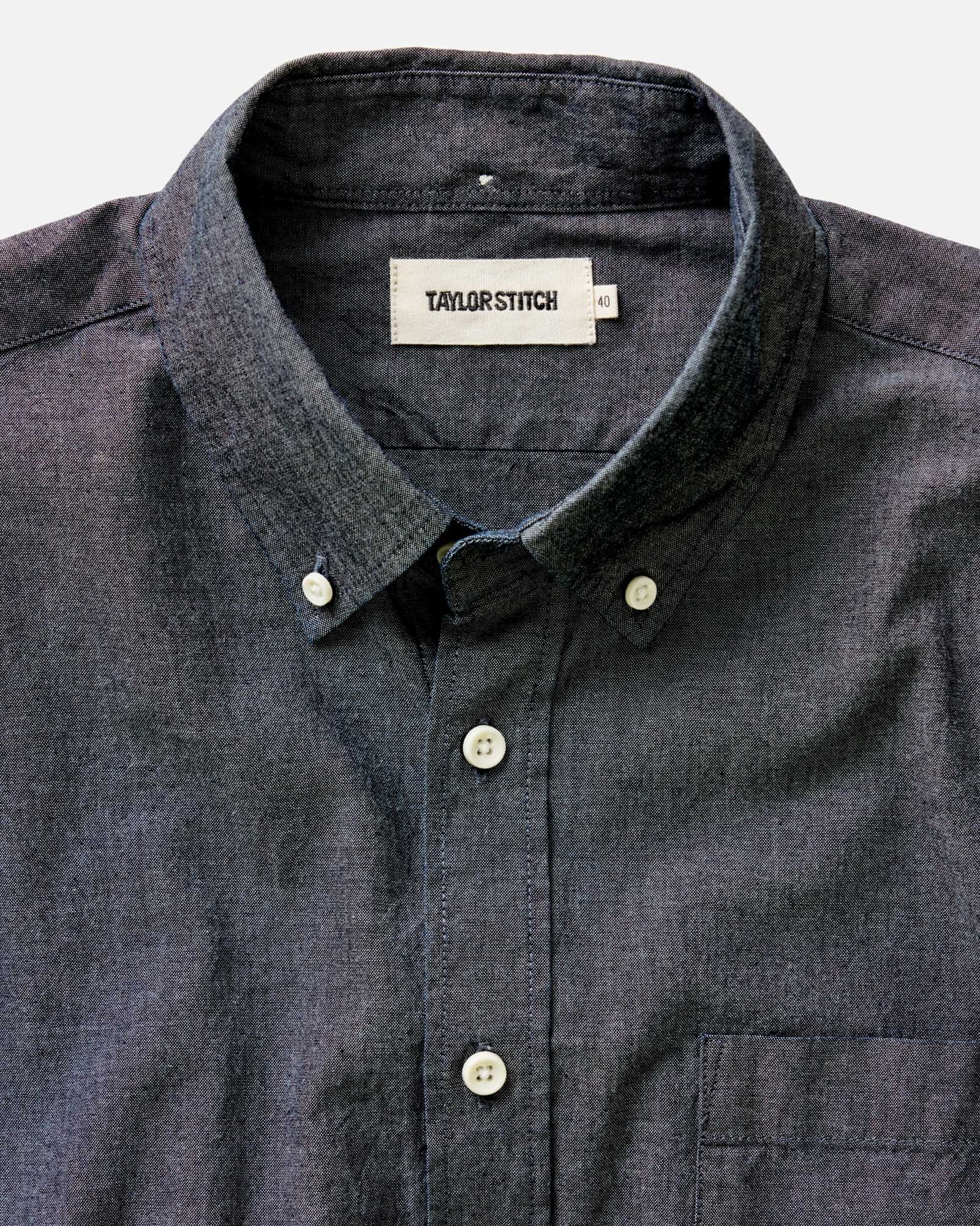 fit model sitting wearing The Jack in Rinsed Indigo Chambray, Wovens by Taylor Stitch