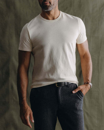 fit model walking wearing The Organic Cotton Tee in Vintage White