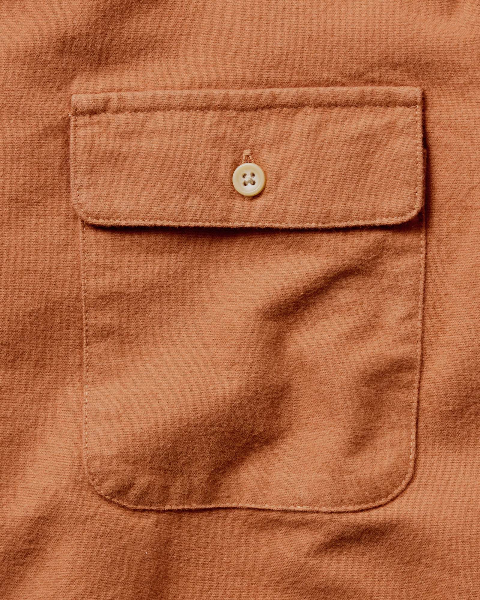 material shot of the pocket on The Yosemite Shirt in Summit Orange, Wovens by Taylor Stitch