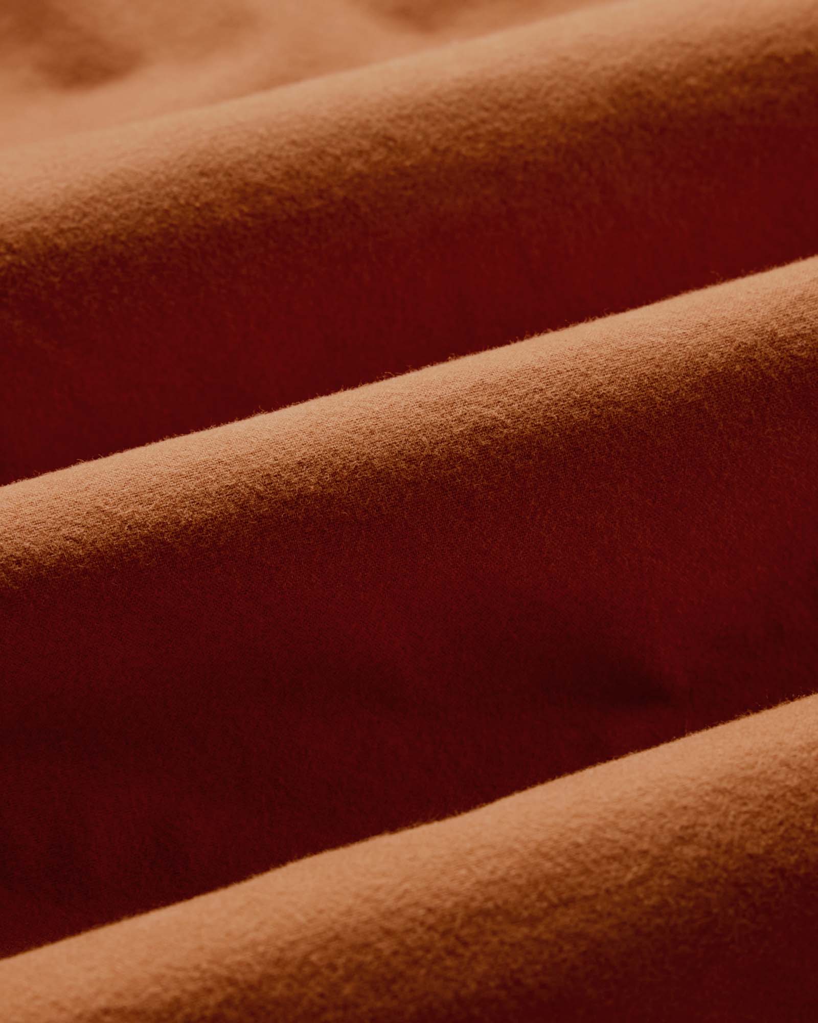 material shot of the fabric on The Yosemite Shirt in Summit Orange, Wovens by Taylor Stitch