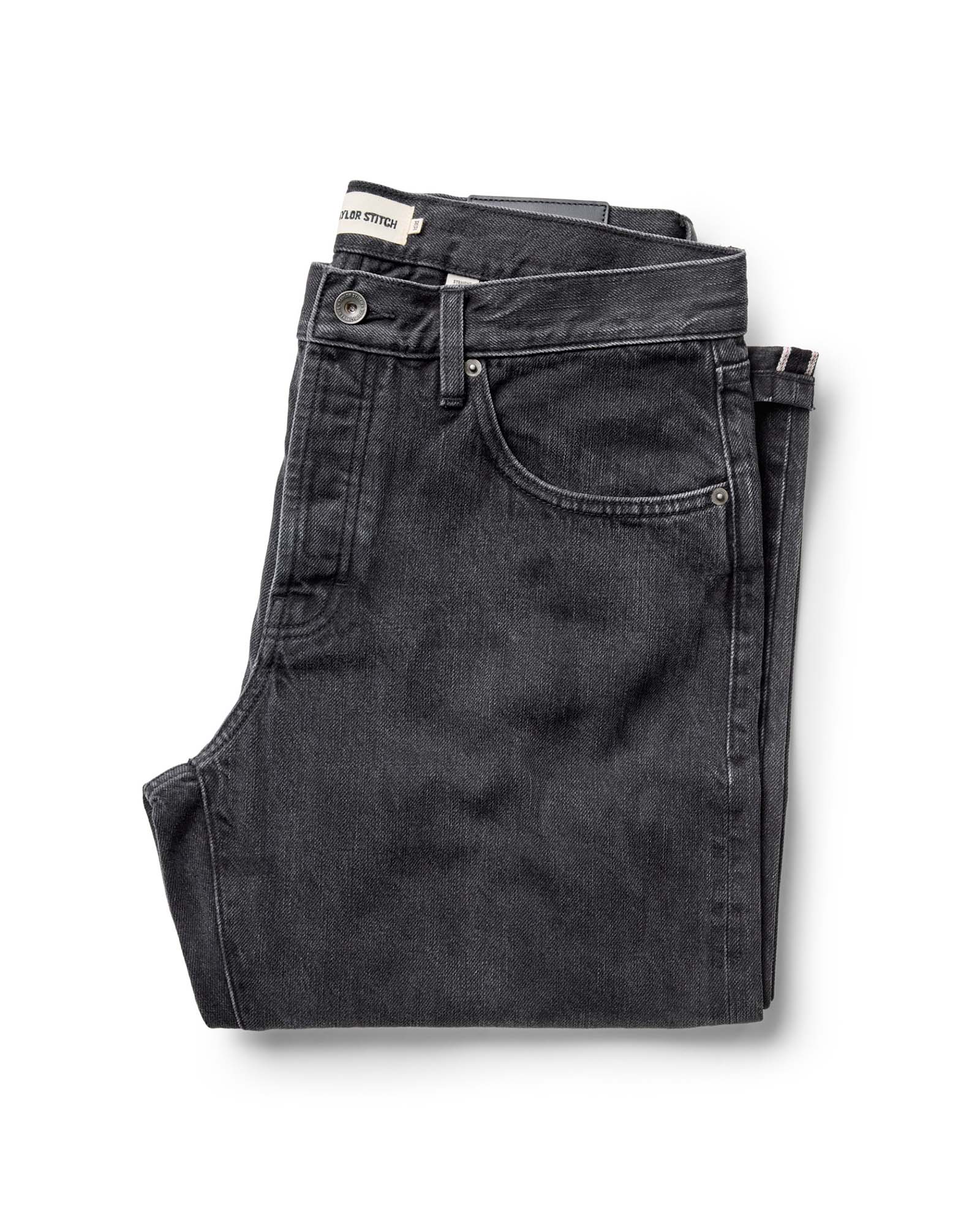 folded flatlay of The Straight Jean in Washed Black Organic Slub Selvedge, Bottoms by Taylor Stitch