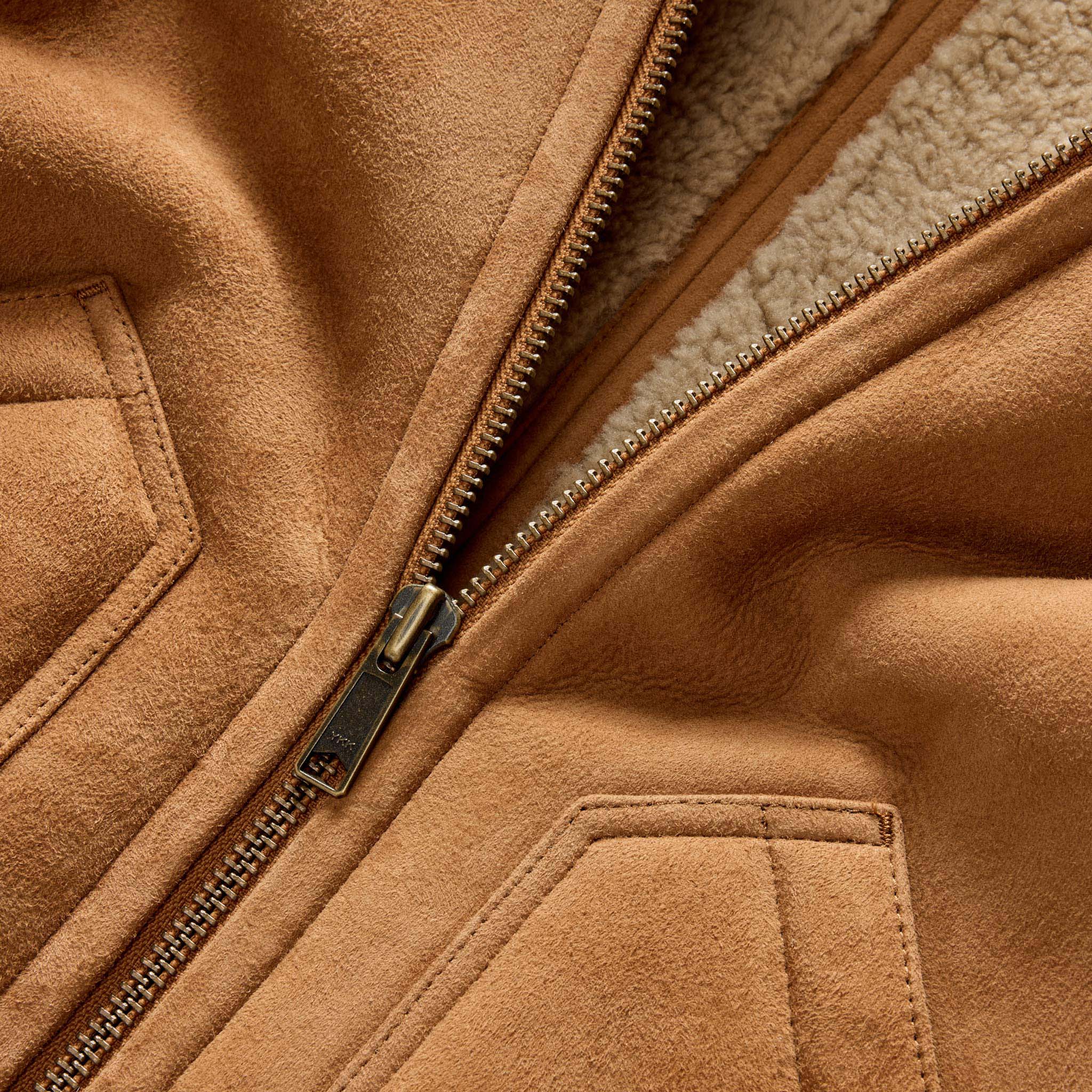 material shot of the YKK zipper on The Wright Jacket in Camel Shearling Leather, Outerwear by Taylor Stitch