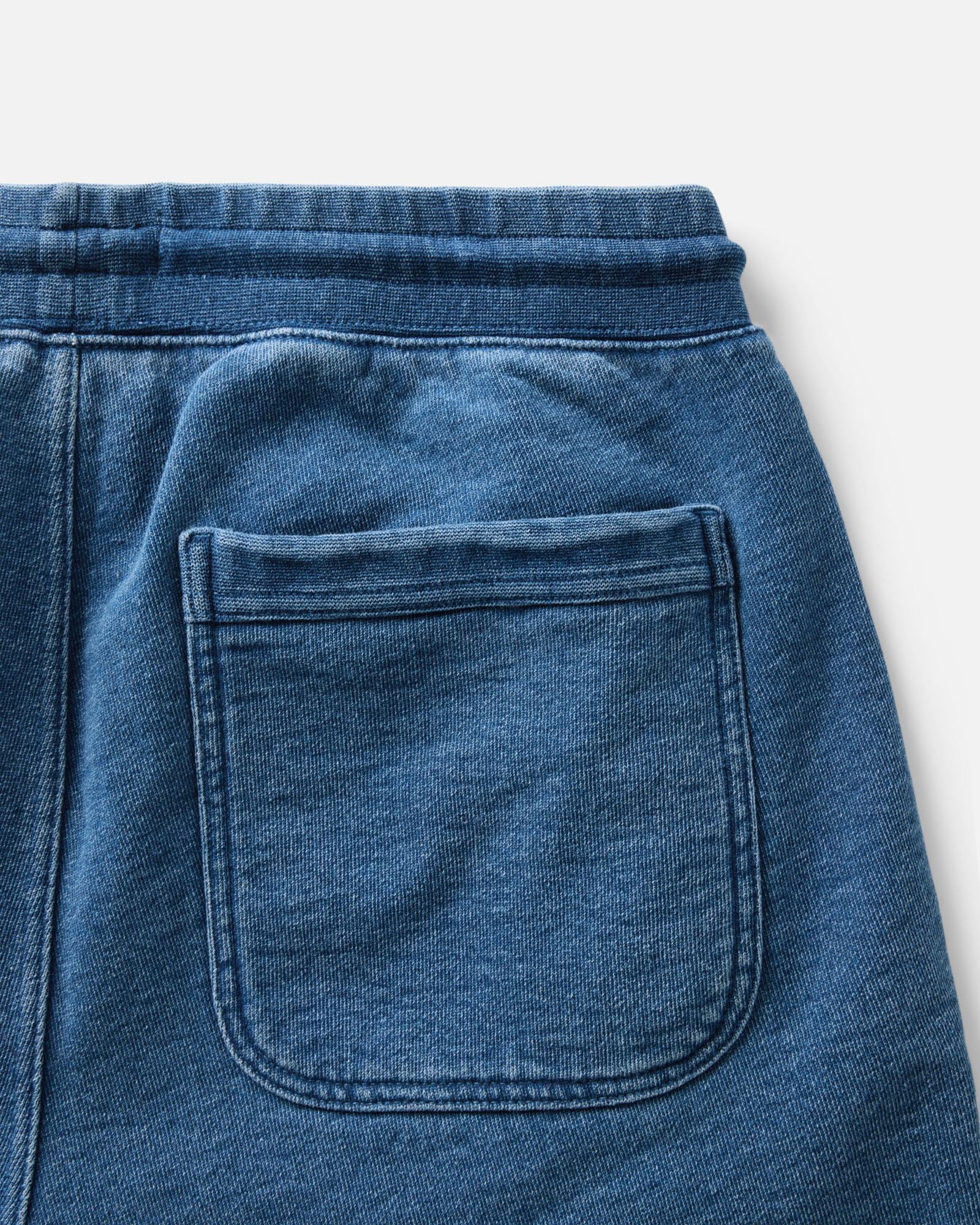 material shot of the back pocket on The Sunset Pant in Washed Indigo Terry, Bottoms by Taylor Stitch