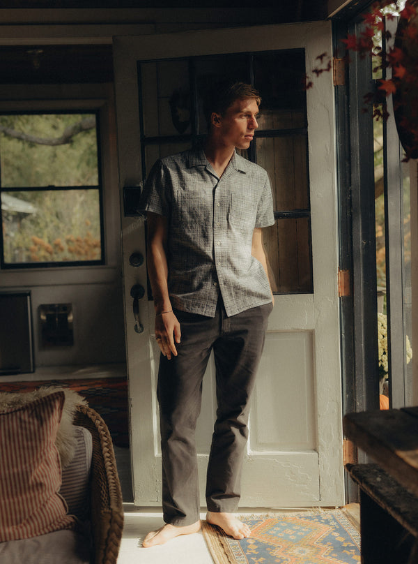 Model looking out the door, wearing the Conrad Shirt