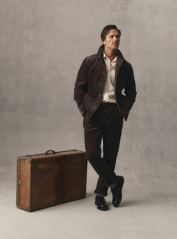 fit model posing in The Carnegie Pant in Soil Corduroy