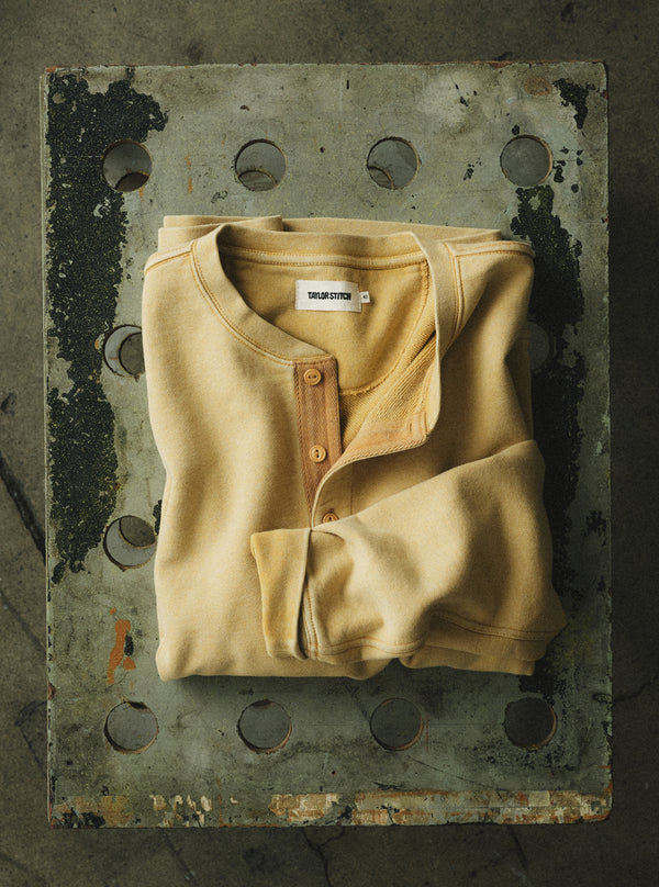 editorial flatlay of The Sunset Henley in Washed Goldfinch Terry