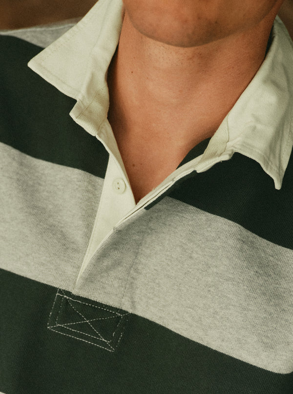 fit model posing in the Rugby Shirt in Dark Forest Stripe