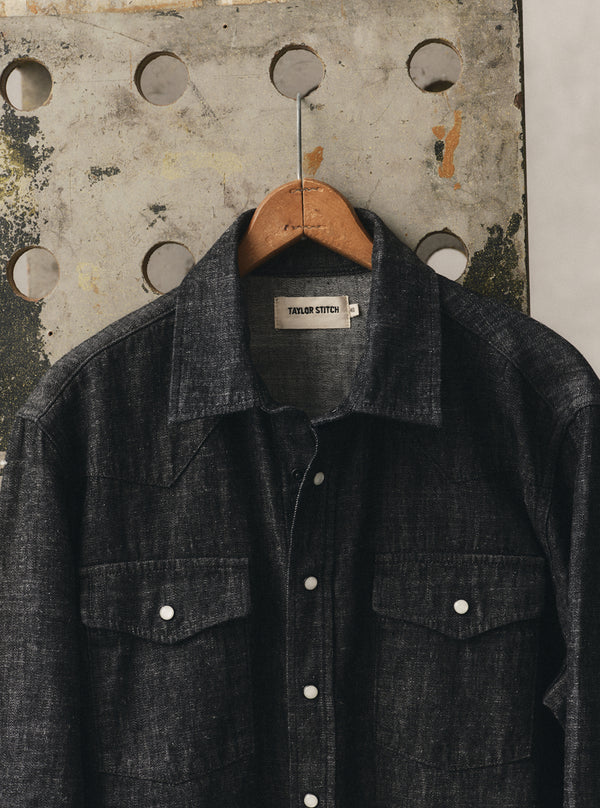 editorial image of The Glacier Shirt in Black Indigo Hemp Denim hanging