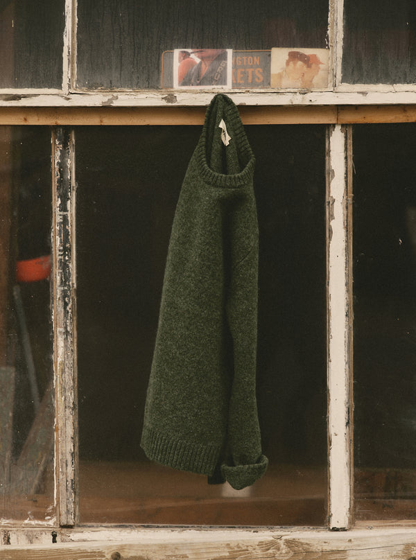 editorial image of The Eastmoor Sweater in Spruce Wool hanging