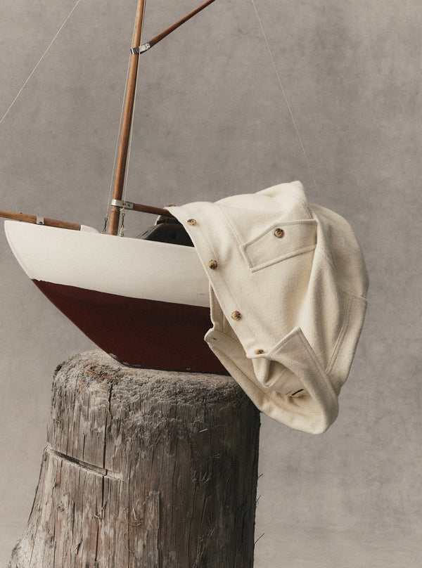 editorial image of The Maritime Shirt Jacket in Vintage White Moleskin Twill on a boat