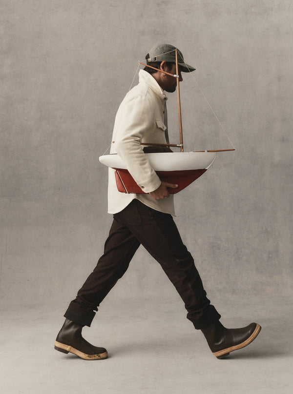 fit model walking wearing The Maritime Shirt Jacket in Vintage White Moleskin Twill