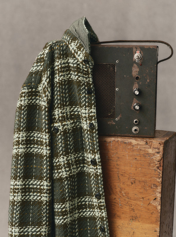 editorial image of The Cutter Overshirt in Buzzard Check hanging
