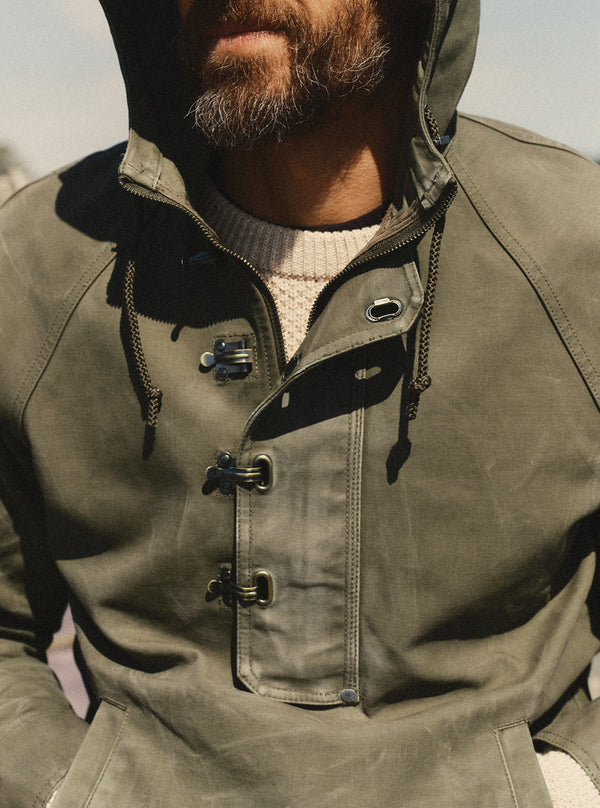 fit model showing off The Hatteras Anorak in Fatigue Olive Dry Wax