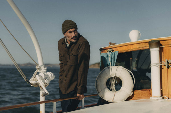 Model on a boat, wearing The Maritime Shirt Jacket