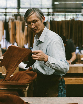 Inspecting raw materials at Golden Bear sportswear factory, one of our industry partners