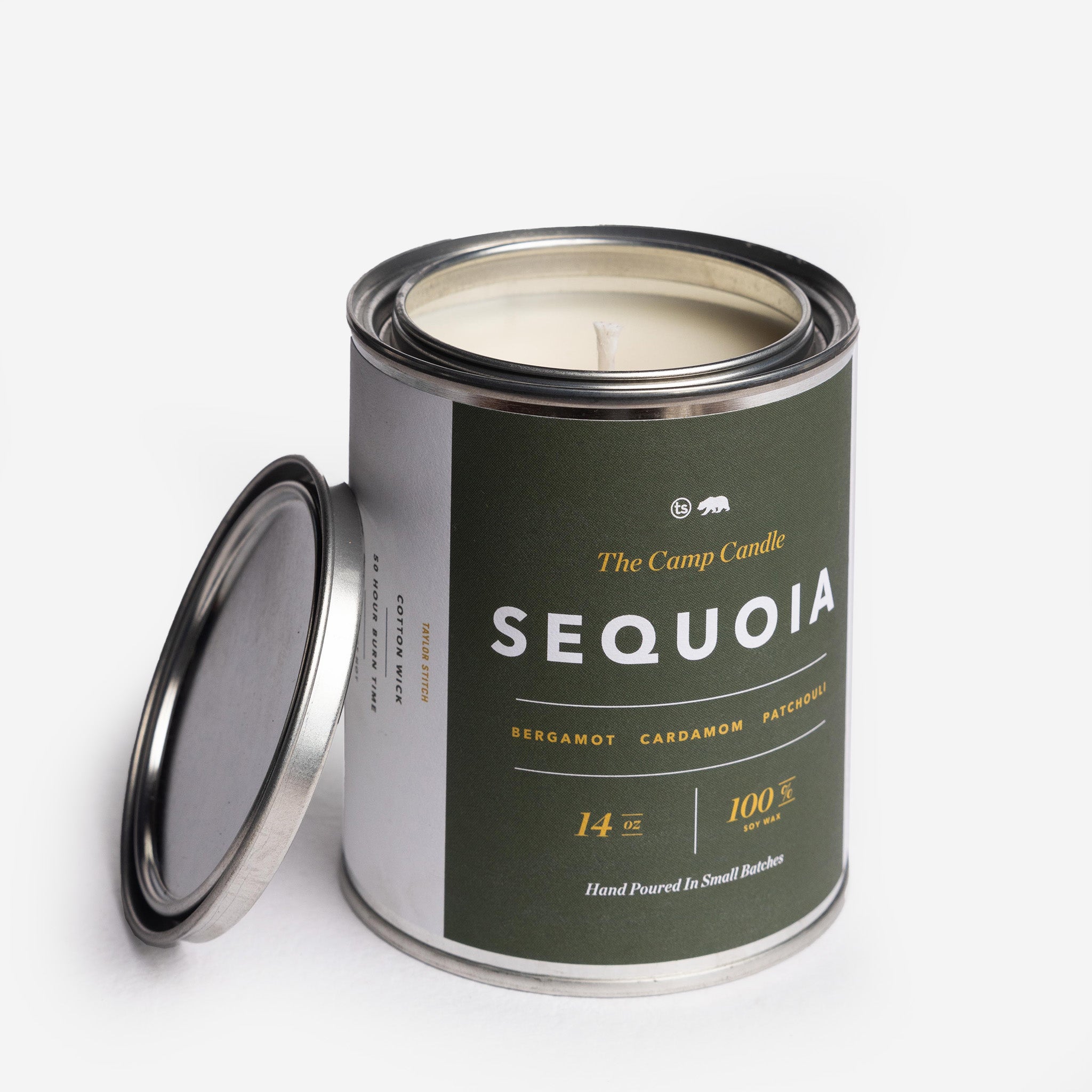 flatlay of The Camp Candle in Sequoia, Accessories by Taylor Stitch