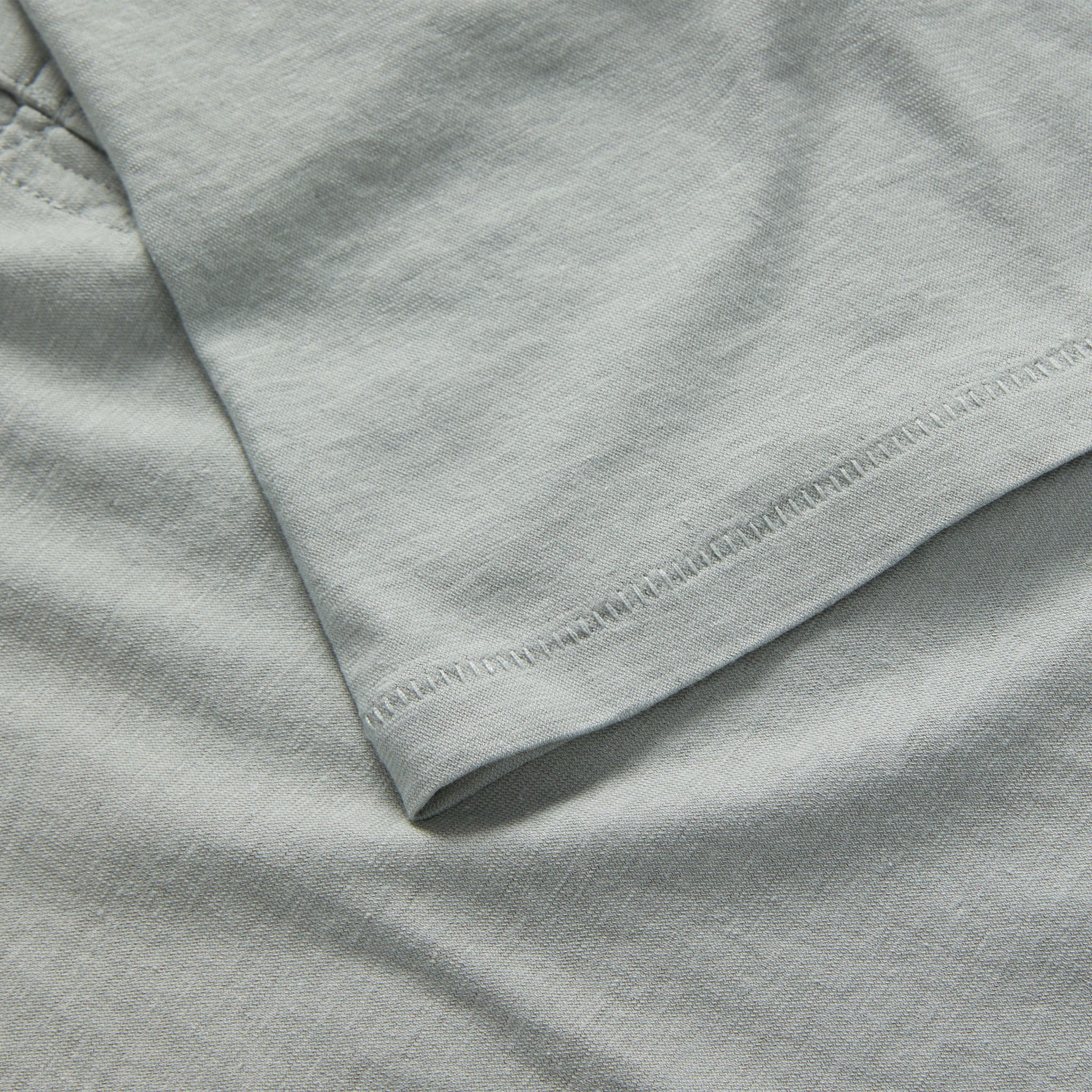 material shot of the sleeve on The Cotton Hemp Polo in Slate, Knits by Taylor Stitch