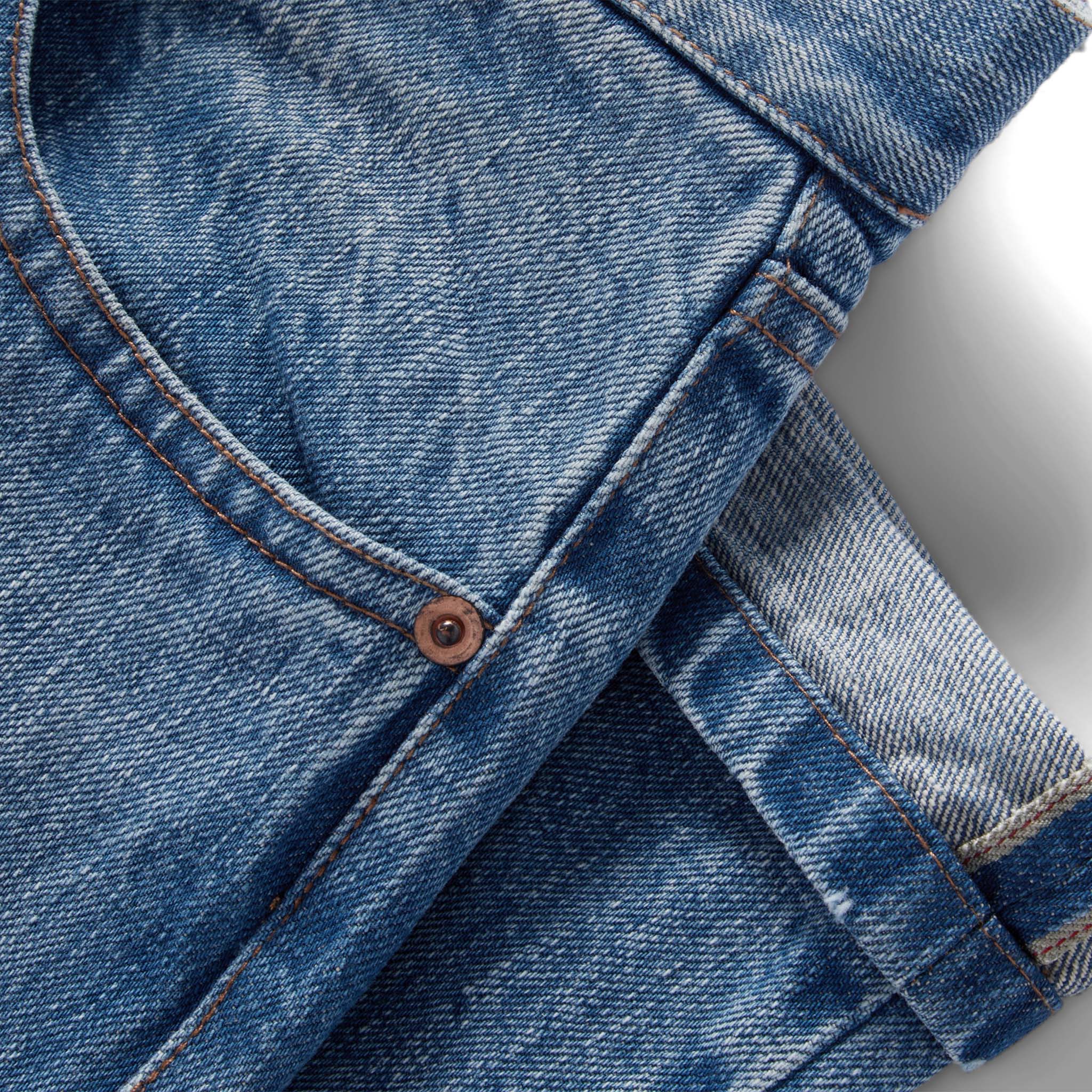 material shot of the selvage cuffs on The Democratic Jean in Fletcher Wash Organic Selvage, Bottoms by Taylor Stitch