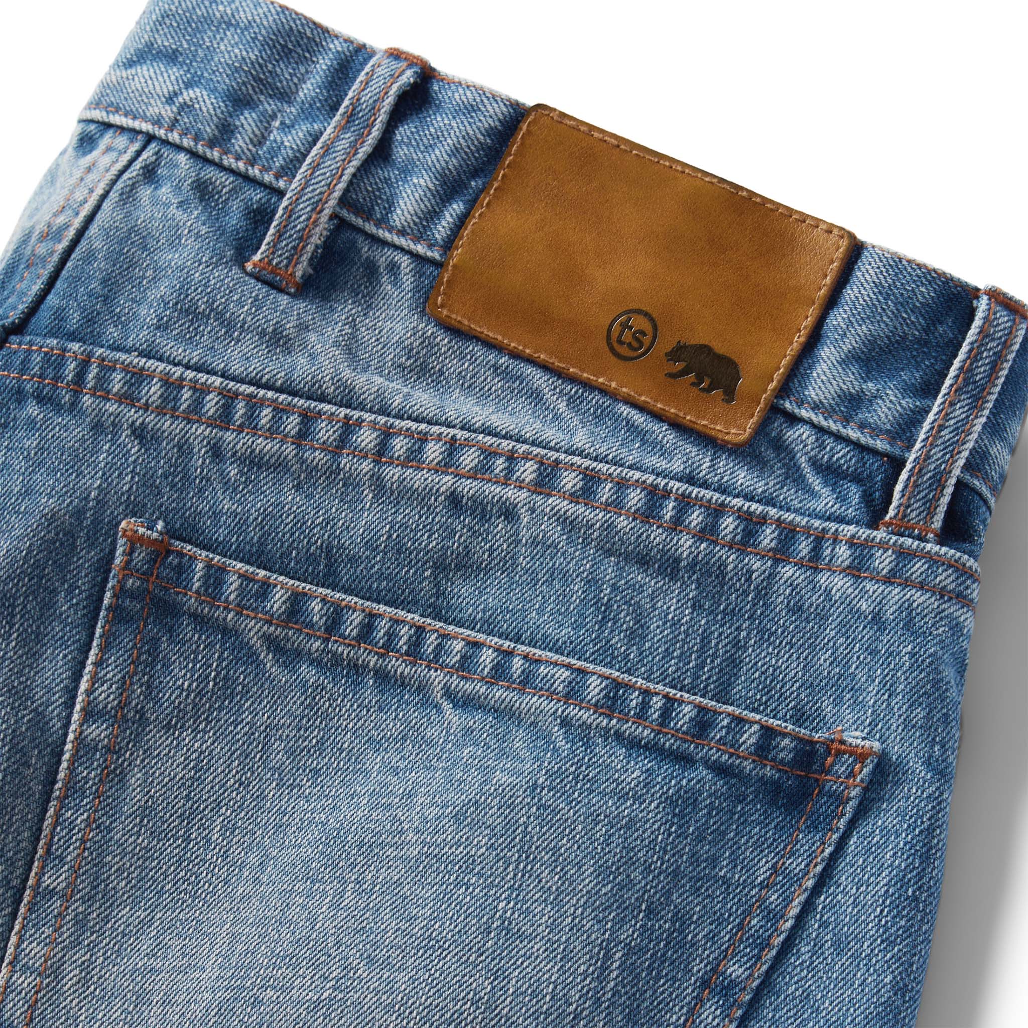 material shot of the logo patch on The Democratic Jean in Fletcher Wash Organic Selvage, Bottoms by Taylor Stitch
