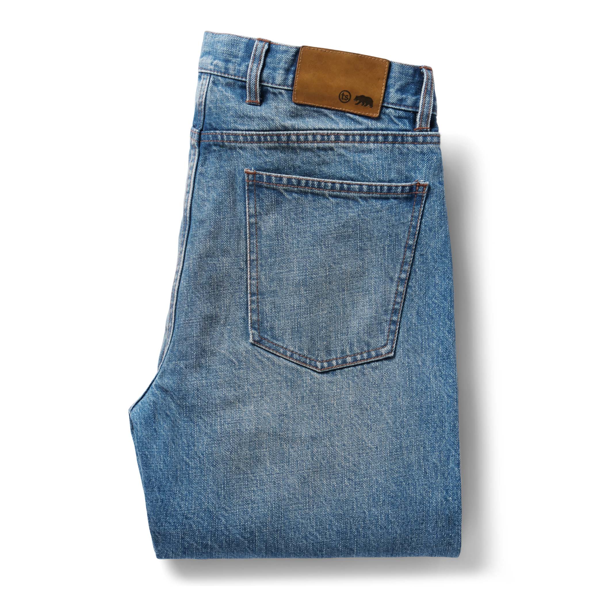 flatlay of the back of The Democratic Jean in Fletcher Wash Organic Selvage folded, Bottoms by Taylor Stitch