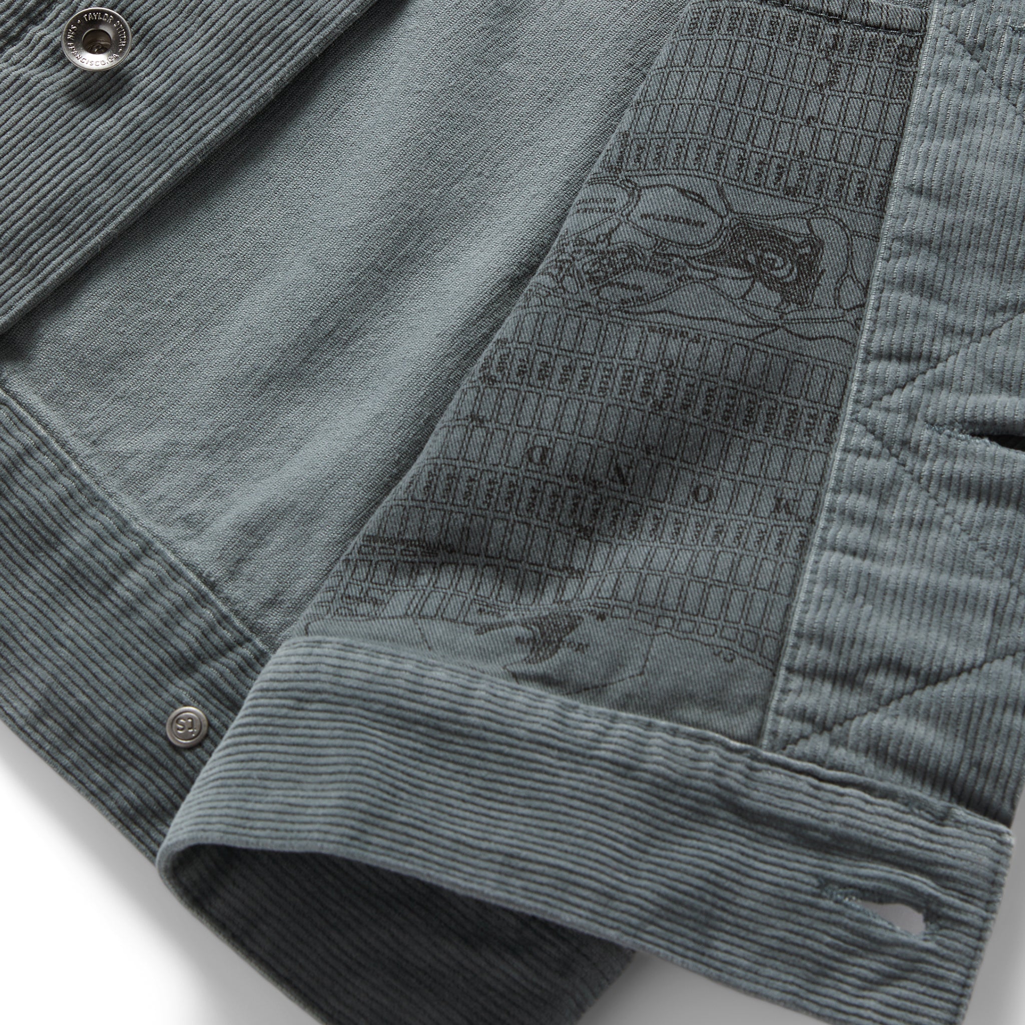 material shot of the map print lining in The Long Haul Jacket in Storm Cord, Outerwear by Taylor Stitch