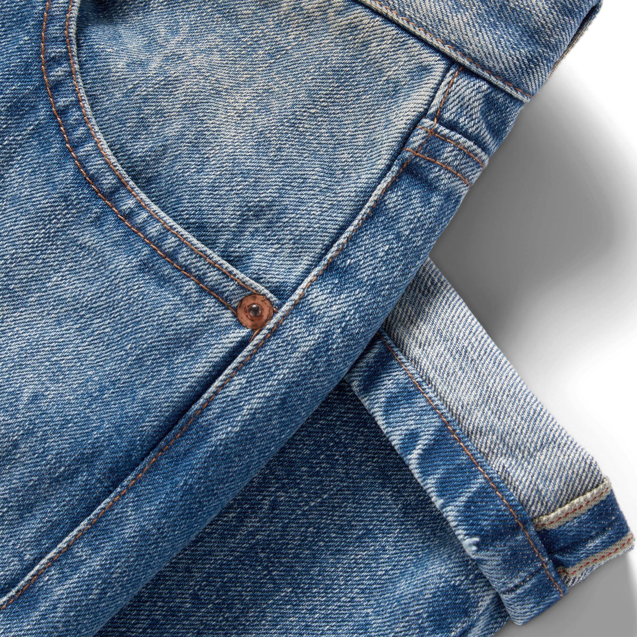 material shot of the selvage cuffs on The Slim Jean in Fletcher Wash Organic Selvage, Bottoms by Taylor Stitch