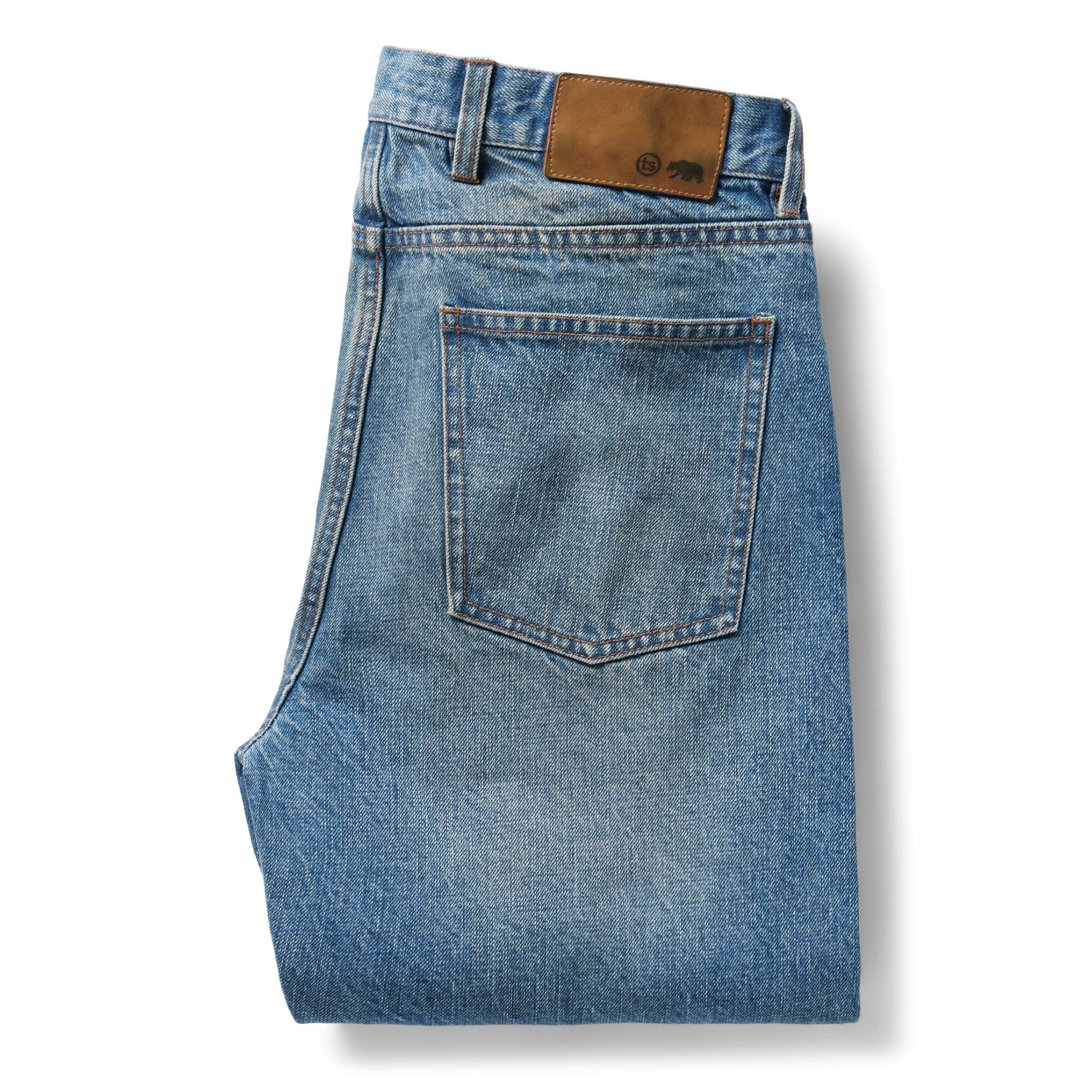 flatlay of the back of The Slim Jean in Fletcher Wash Organic Selvage folded, Bottoms by Taylor Stitch