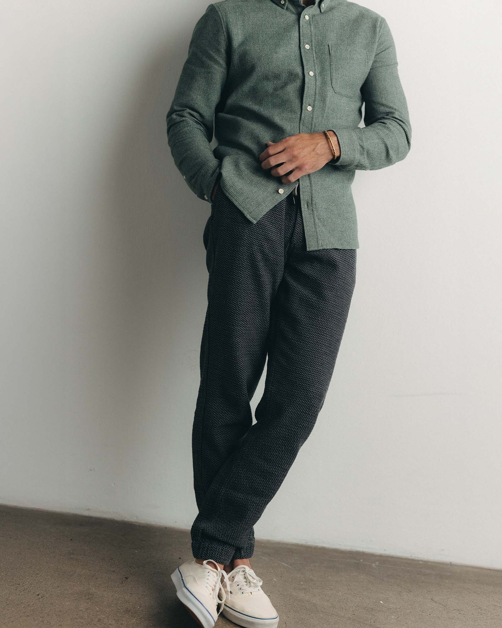 fit model wearing The Apres Pant in Charcoal Sashiko, hands in pockets, Bottoms by Taylor Stitch