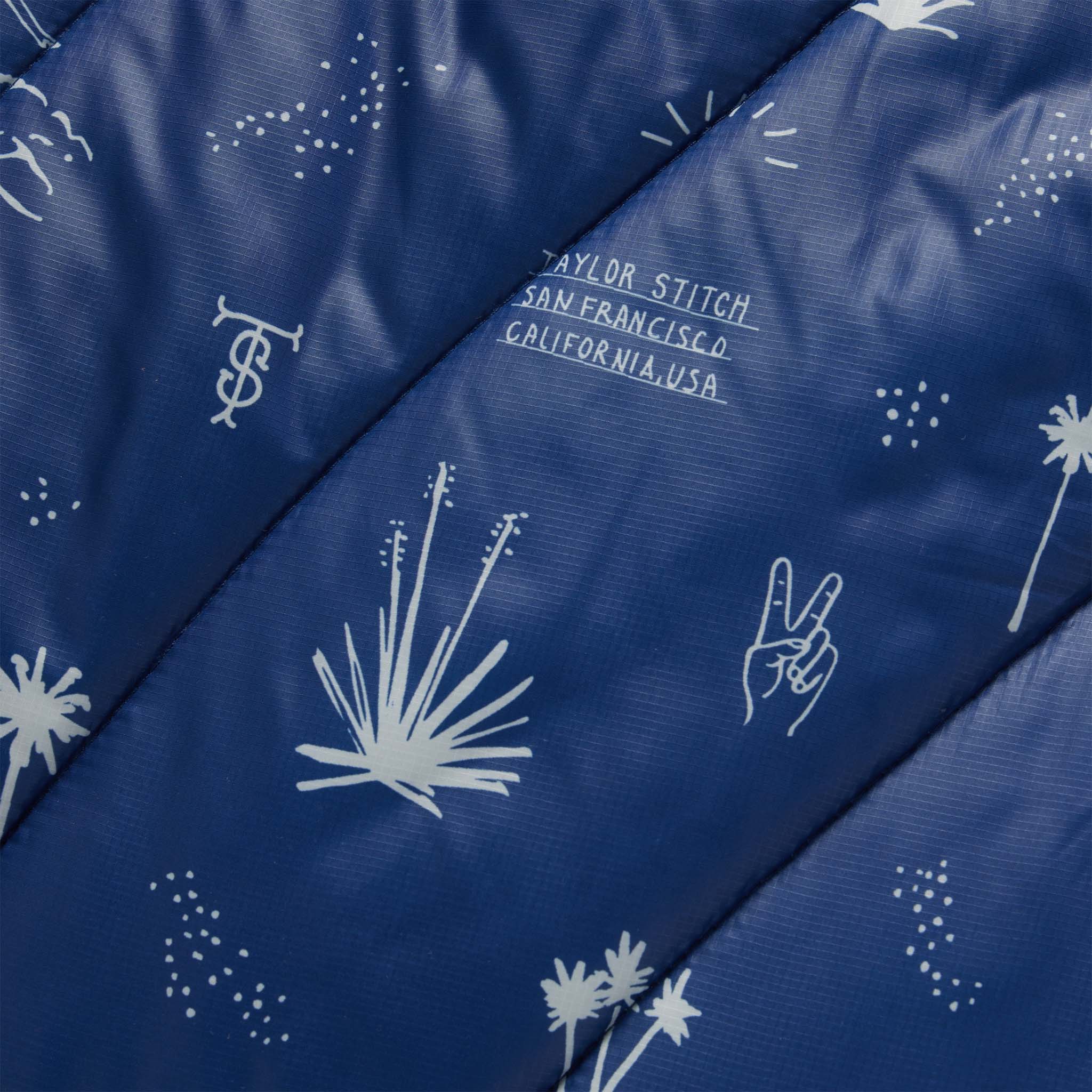 material shot of the pattern on The Original Puffy Blanket in Navy Aloha, Accessories by Taylor Stitch