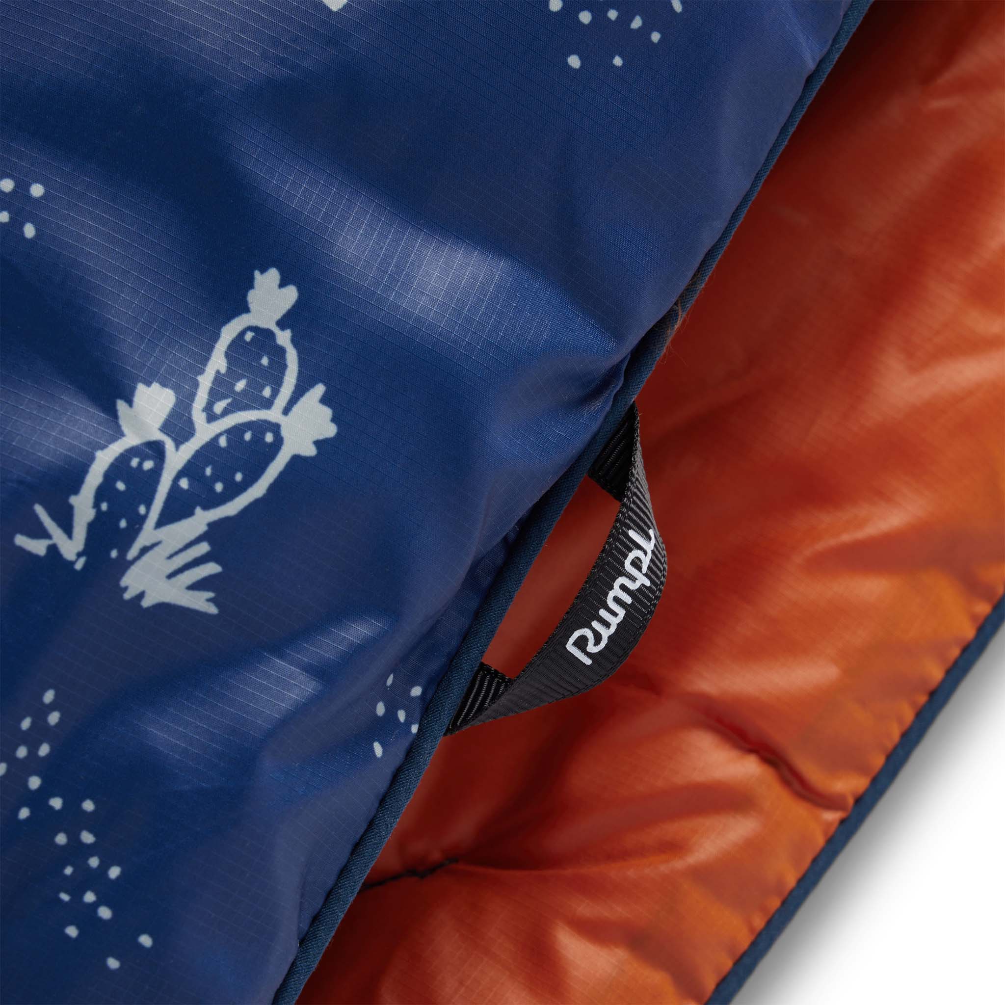 material shot of the corner loops on The Original Puffy Blanket in Navy Aloha, Accessories by Taylor Stitch