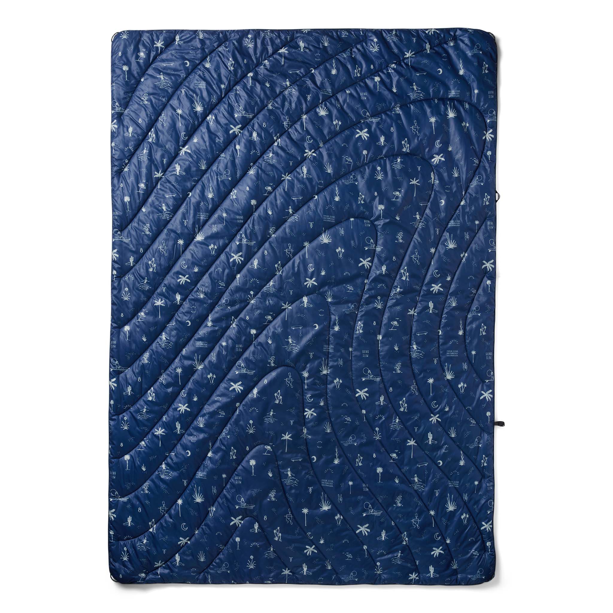 flatlay of The Original Puffy Blanket in Navy Aloha, shown in full, Accessories by Taylor Stitch