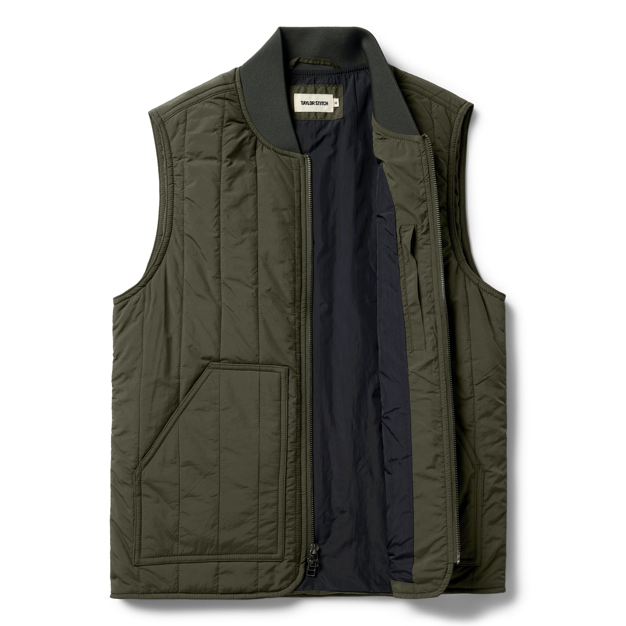 flatlay of The Able Vest in Quilted Army, shown zipped open, Outerwear by Taylor Stitch